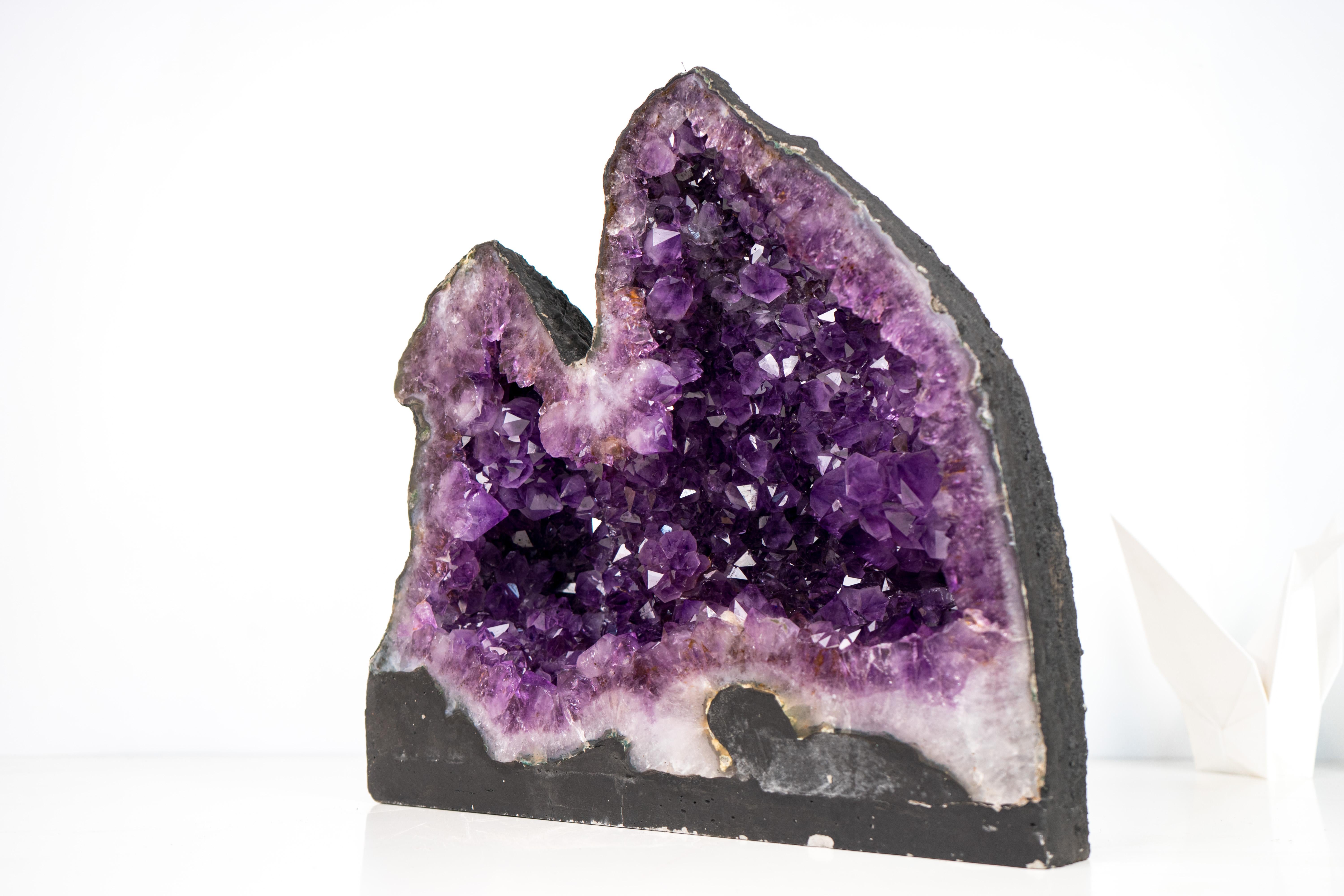 Gorgeous Deep, Saturated Purple Amethyst Geode formed as a Twin Geode

▫️ Description

With a rare twin formation, this Amethyst geode presents an aesthetically pleasing shape adorned with vibrant purple crystals. It’s a unique natural work of art,