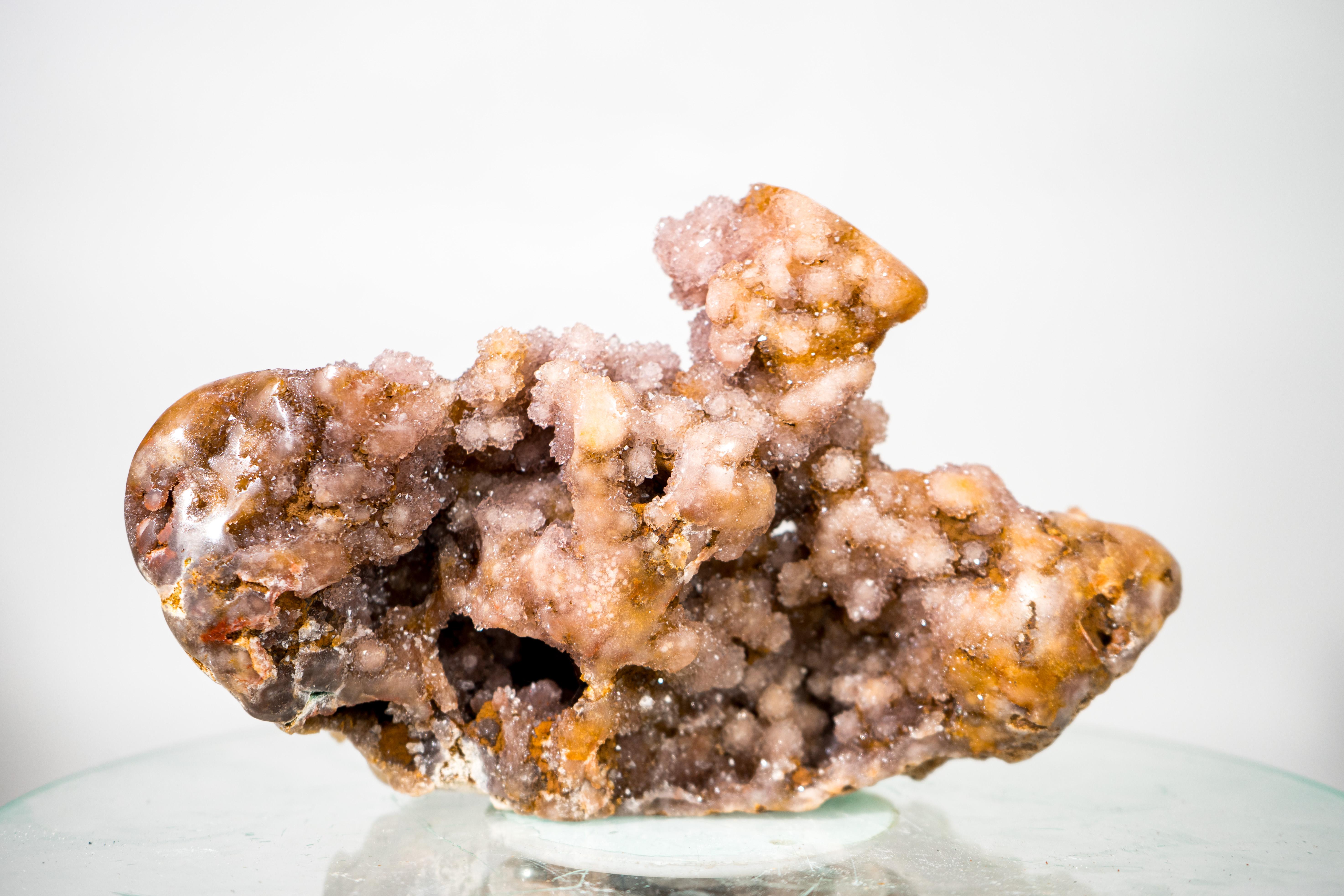 Red and Pink Amethyst Geode Specimen with Sparkly Red Druzy

▫️ Description

A delicate, aesthetic Pink Amethyst specimen from Brazil that’s nothing short of gorgeous. This 100% natural piece features a rare formation, with hundreds of botryoidal