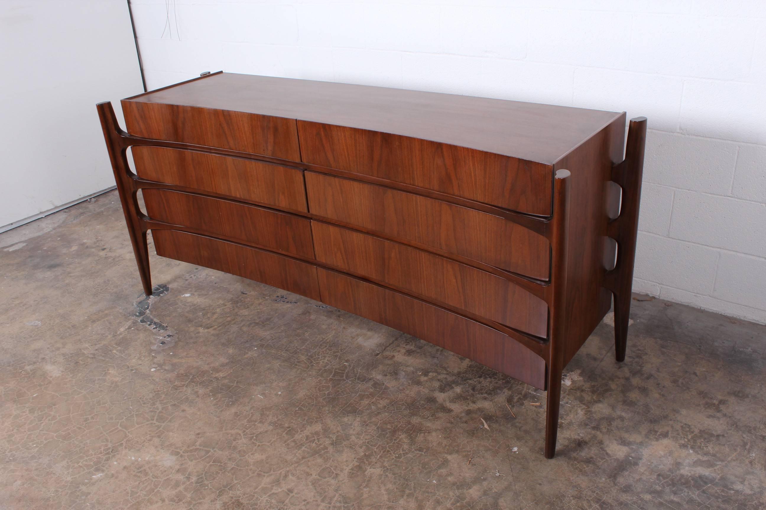 A sculptural walnut eight-drawer dresser designed by William Hinn and 
made in Sweden by the Swedish furniture guild for Urban Furniture.