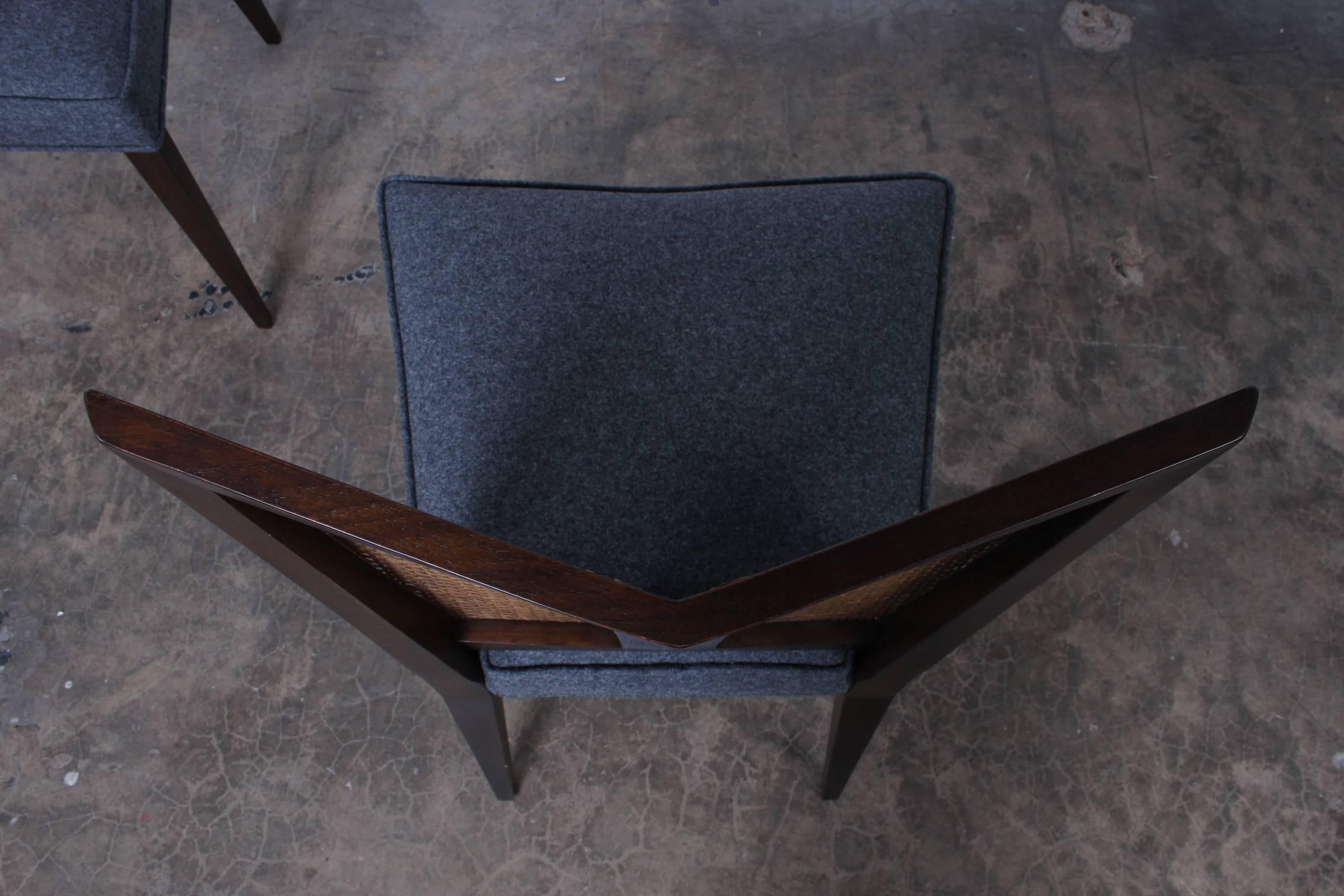 A rare set of eight V-back dining chairs by Baker.