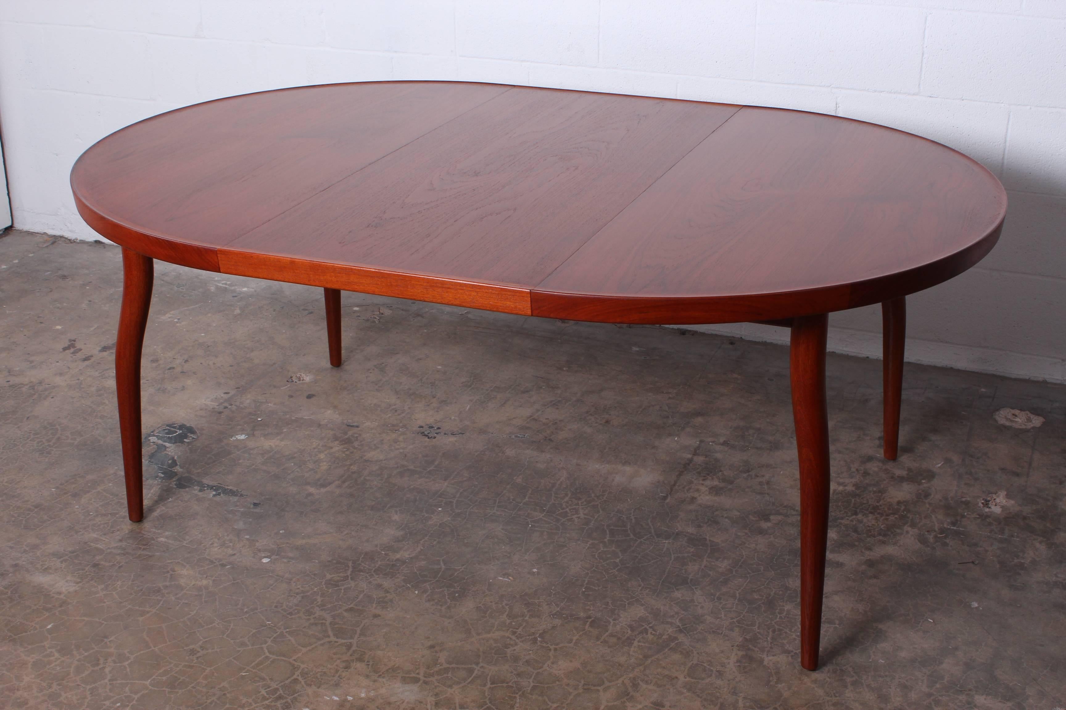 A rare teak NV56 dining table designed by Finn Juhl for Niels Vodder. Table measures 49