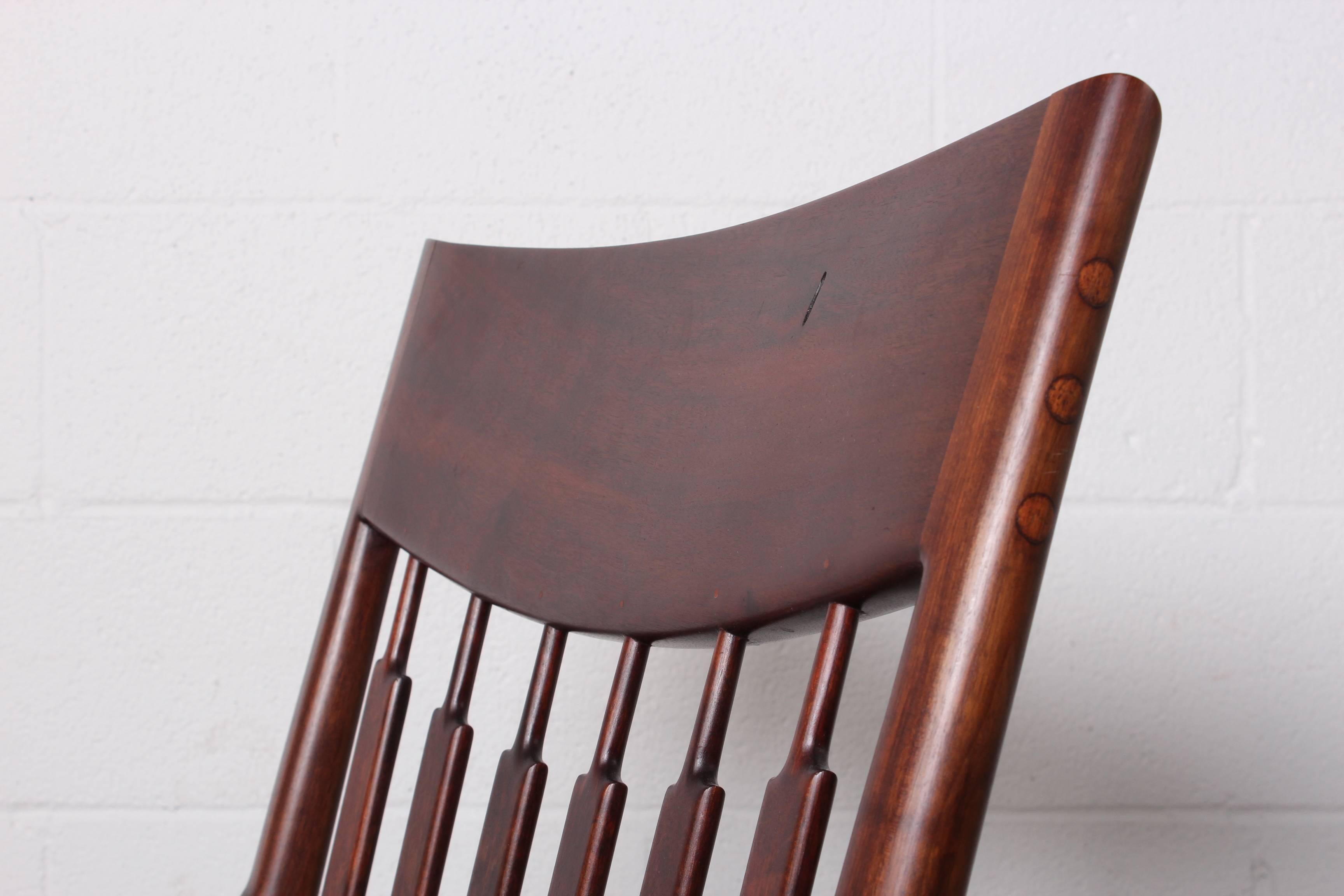 Handcrafted walnut lounge chair by California craftsman John Nyquist.