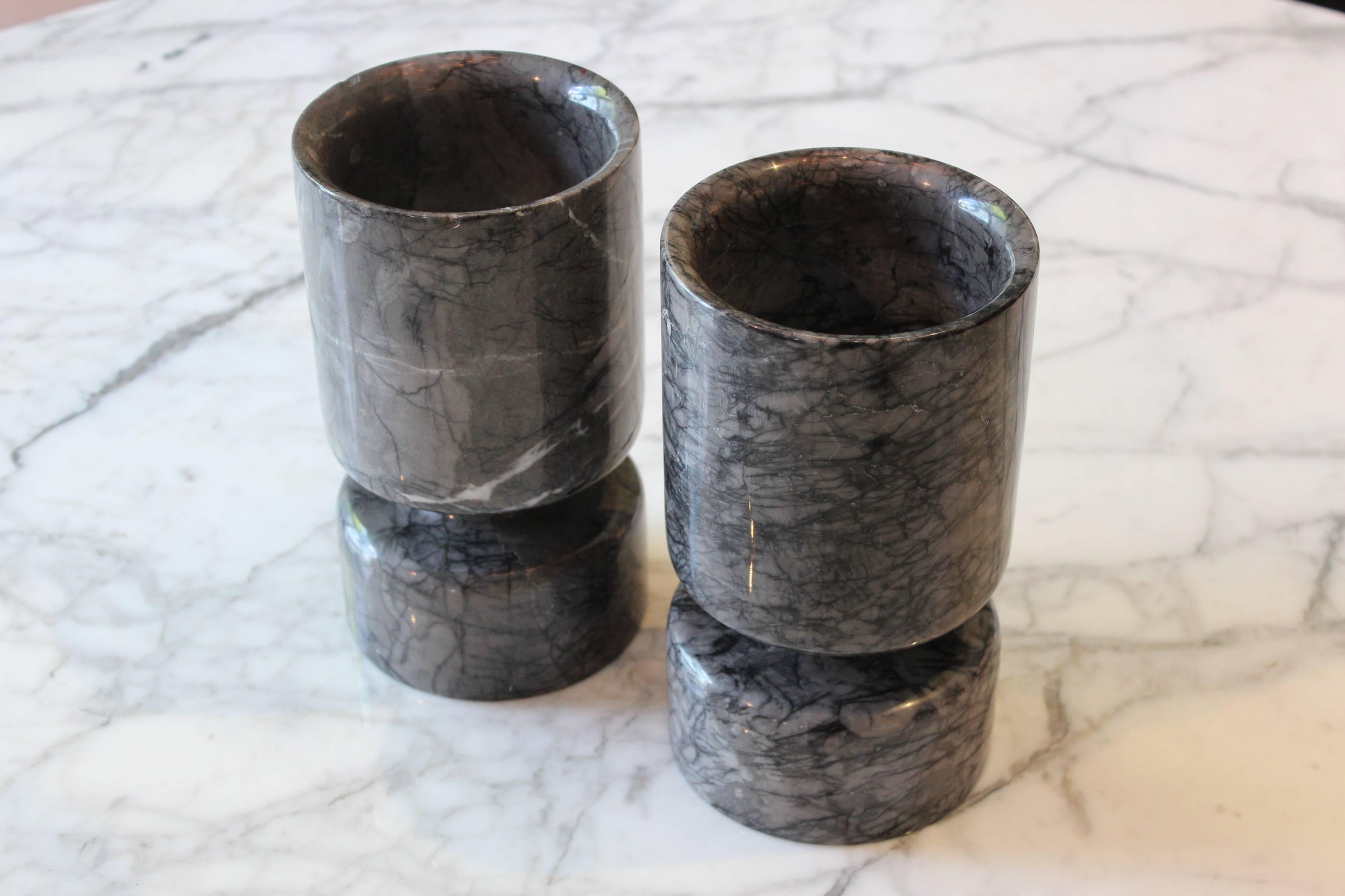 A beautiful pair of reversible grey marble vases designed by Angelo Mangiarotti and sold by Knoll. Other forms available.