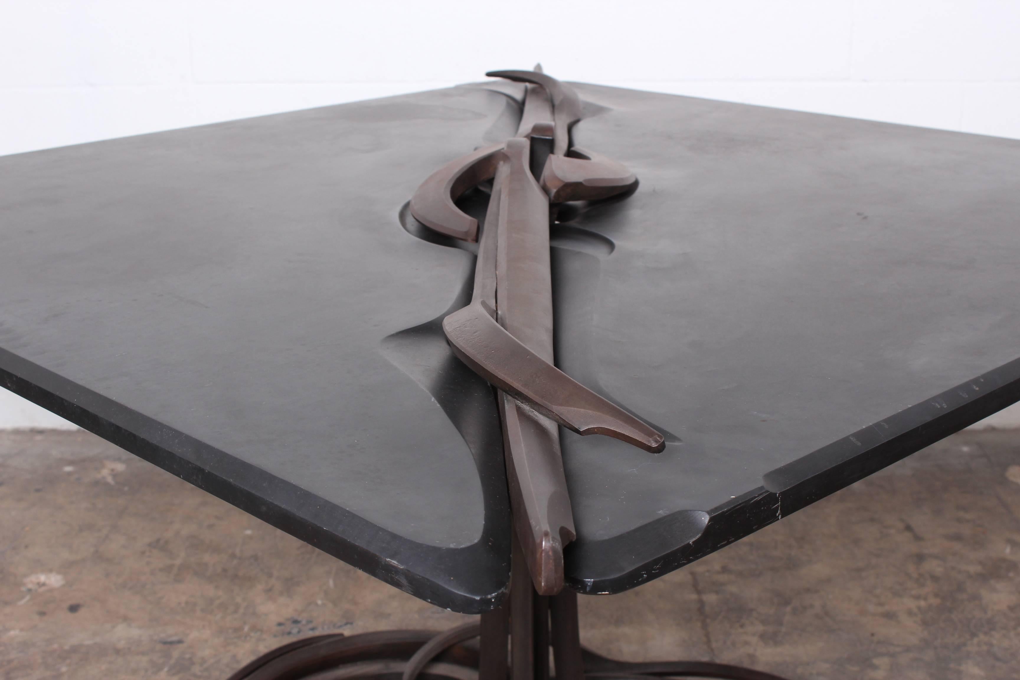 A rare pair of forged steel and carved stone dining / center tables by Albert Paley. 
Stamped PALEY 1982. 
Published: Lucie-Smith, The Art of Albert Paley, Abrams, 1996, p. 197; Museum of Fine Arts, Albert Paley: The Art of Metal exhibition