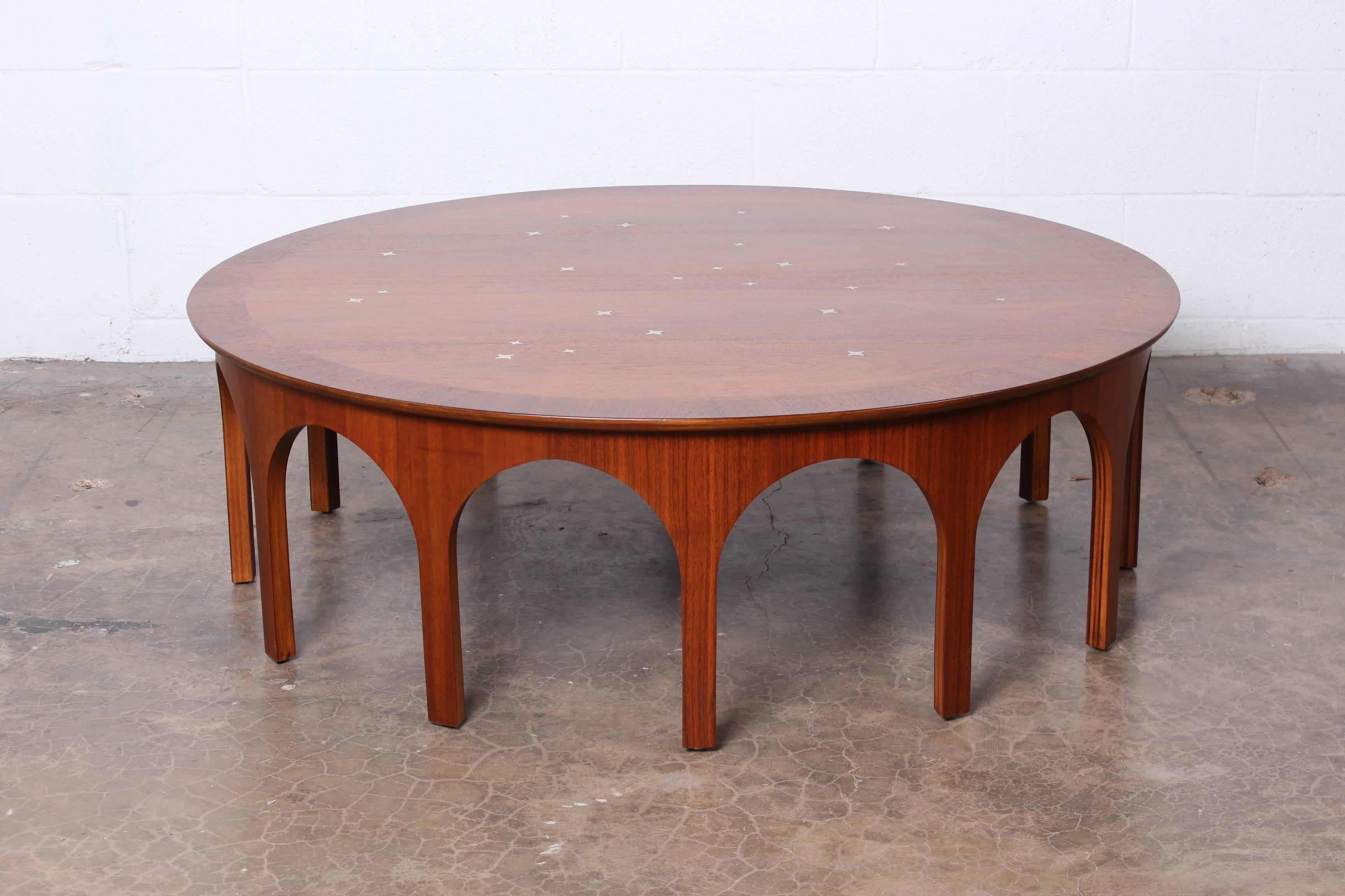 A rare walnut coffee table with inset aluminum stars. Designed by 
T.H. Robsjohn-Gibbings for Widdicomb.