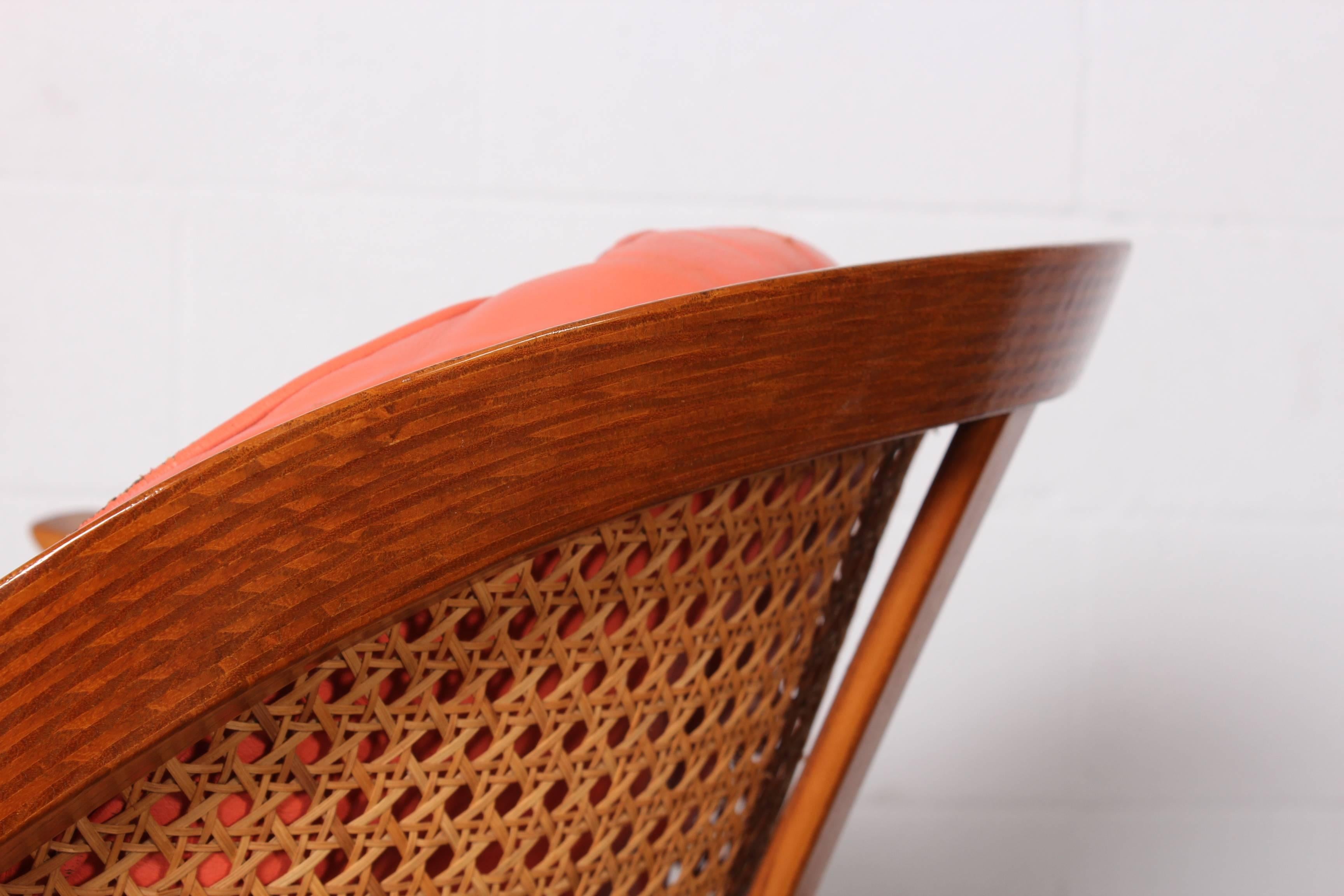 An elegant A-frame lounge chair with original pink leather. Designed by Edward Wormley for Dunbar.
