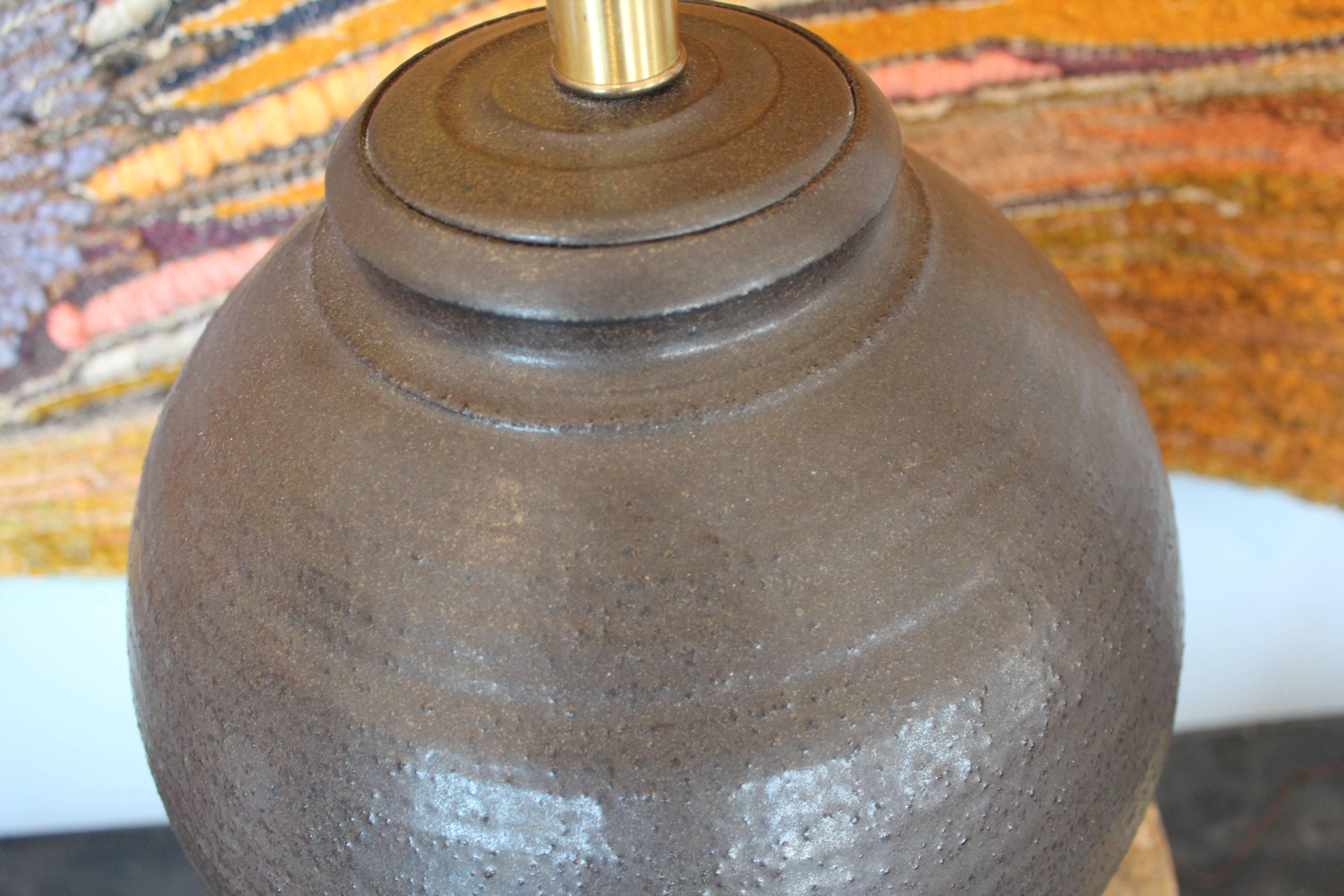 A large ceramic table lamp on wooden base by Affiliated Craftsman of California.
