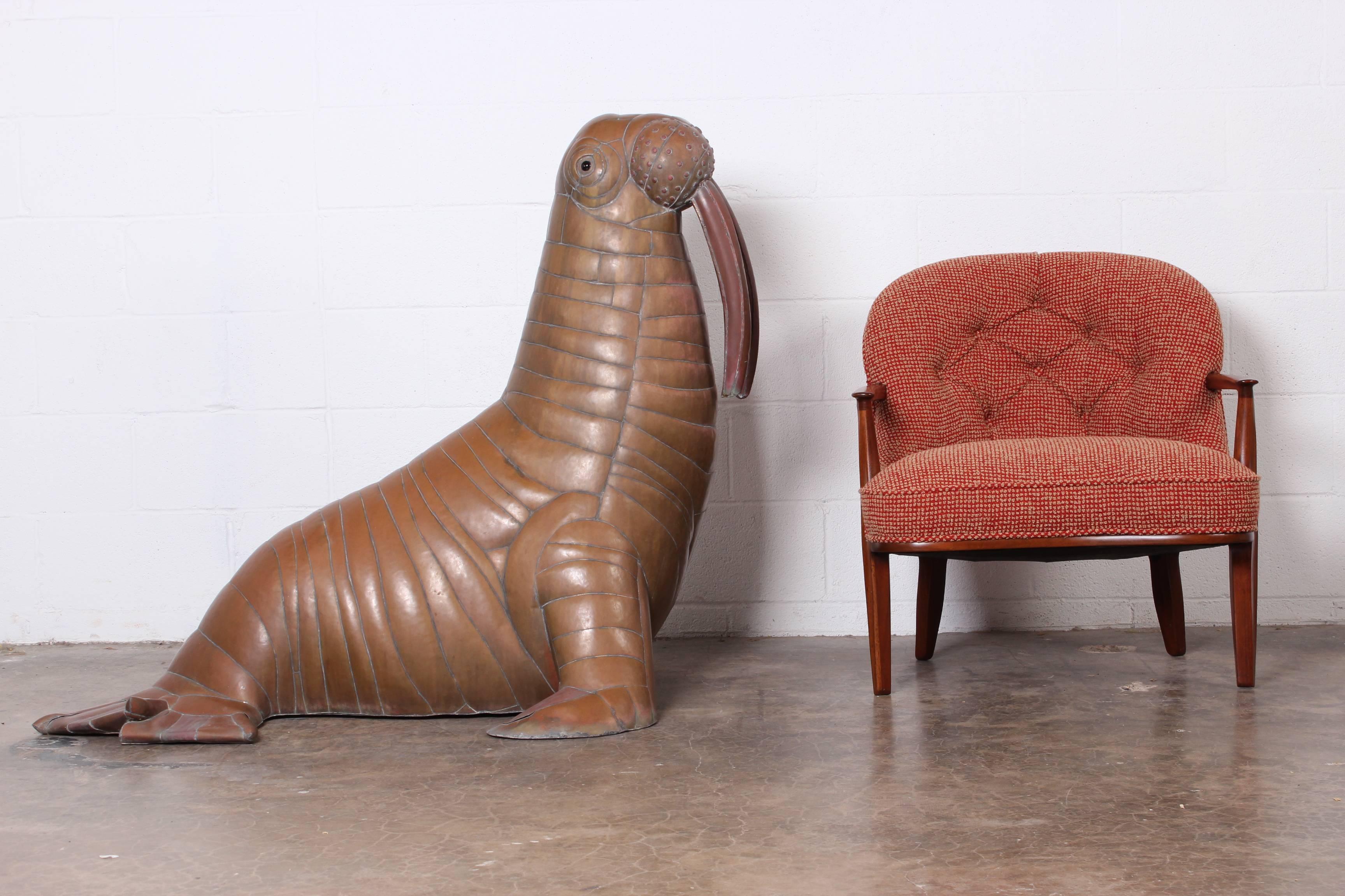 A huge patinated brass walrus sculpture by Sergio Bustamante.
 