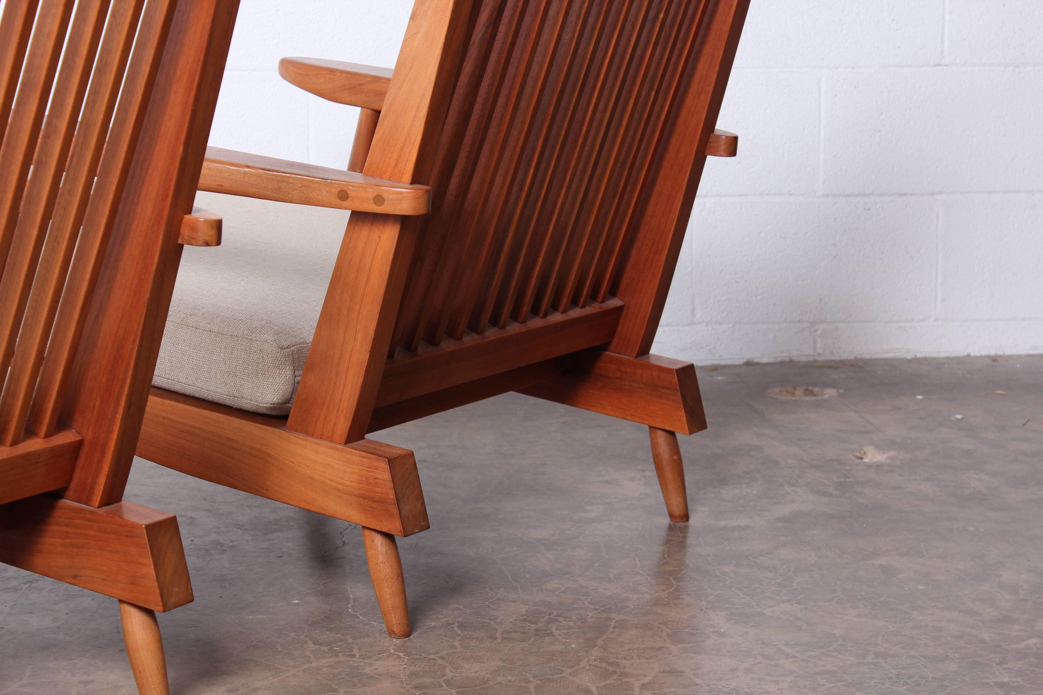 A pair of walnut spindle back lounge armchairs by George Nakashima, 1960.