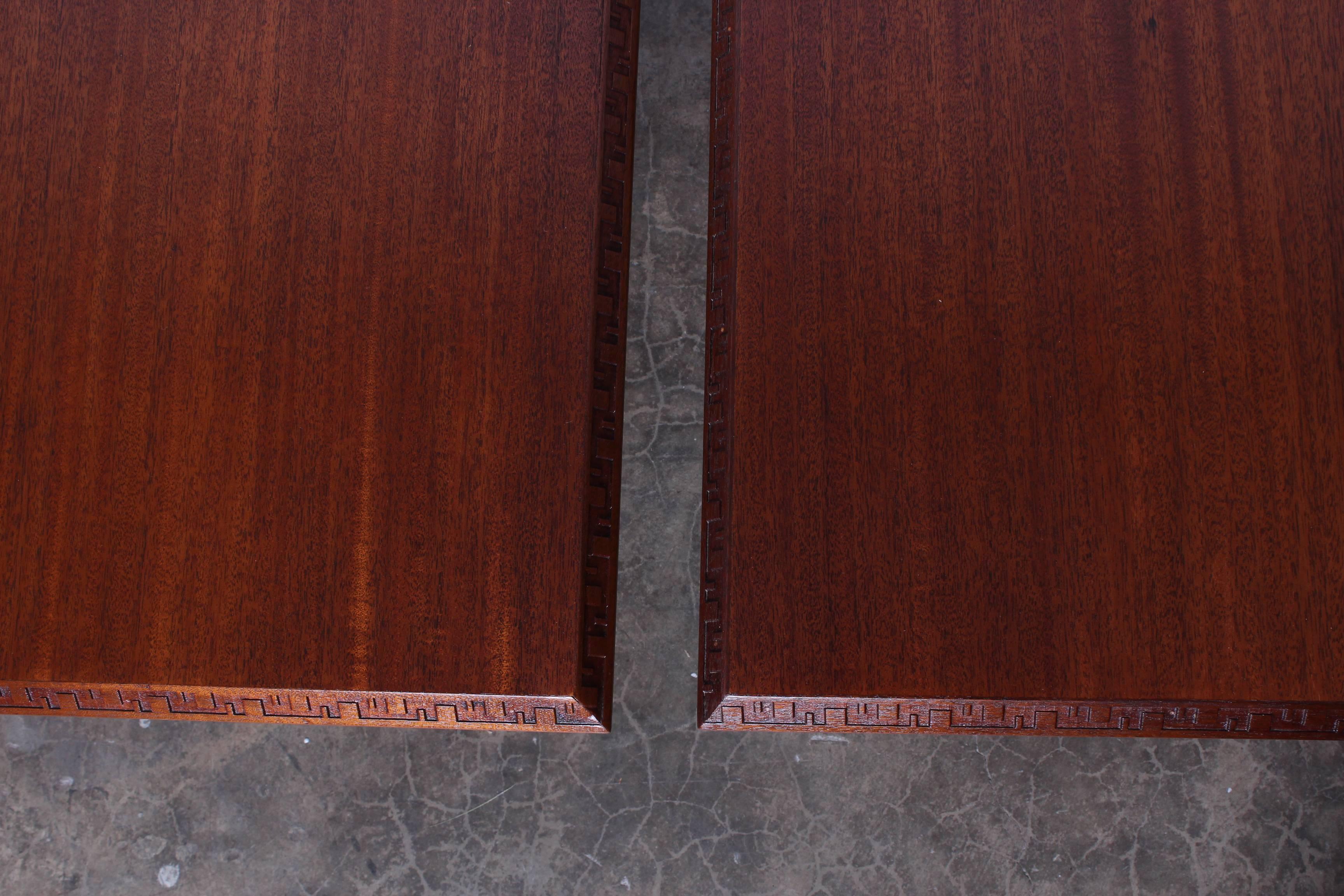 Pair of mahogany tables designed by Frank Lloyd Wright and manufactured by Heritage Henredon.