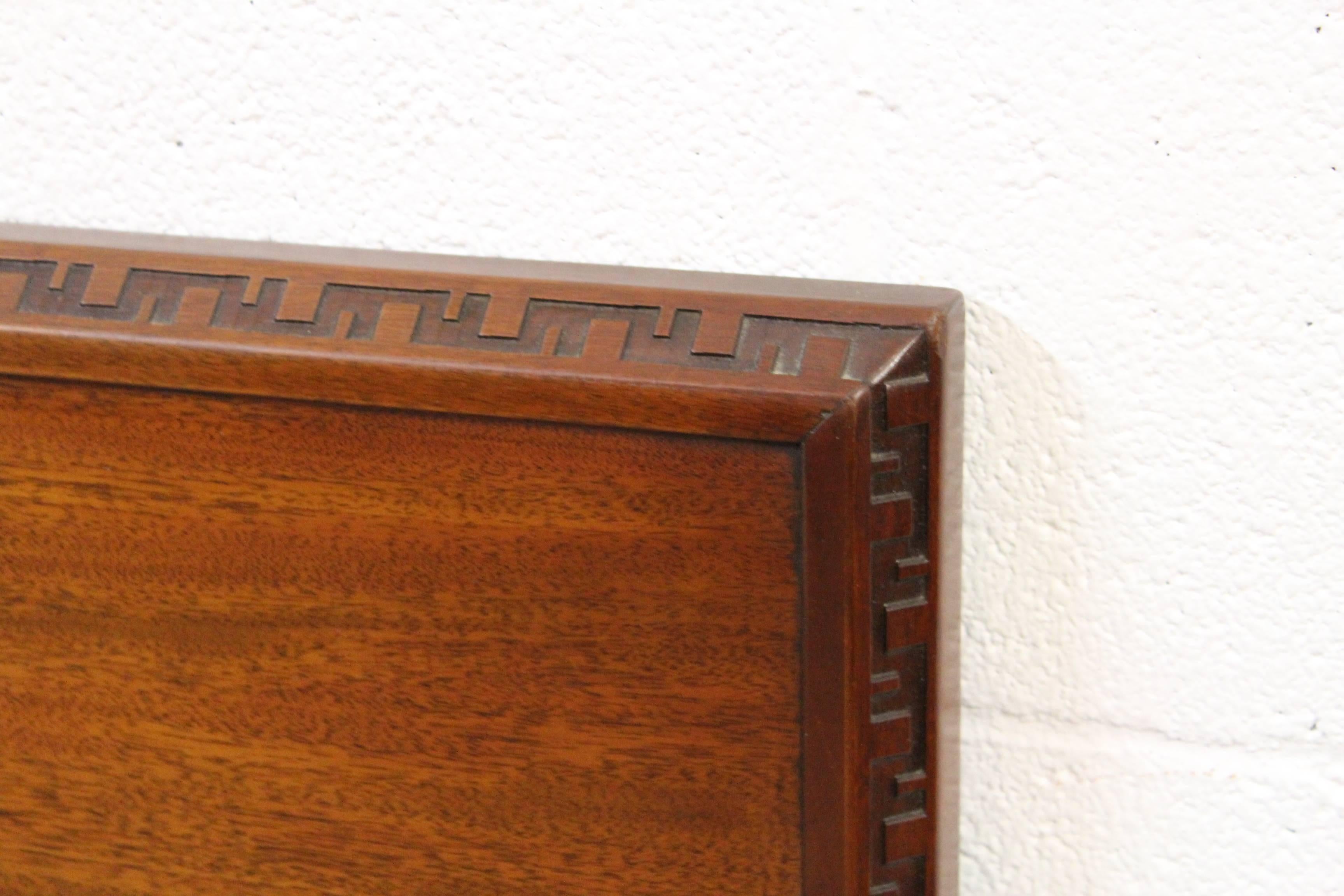 A mahogany headboard designed by Frank Lloyd Wright for Heritage Henredon.