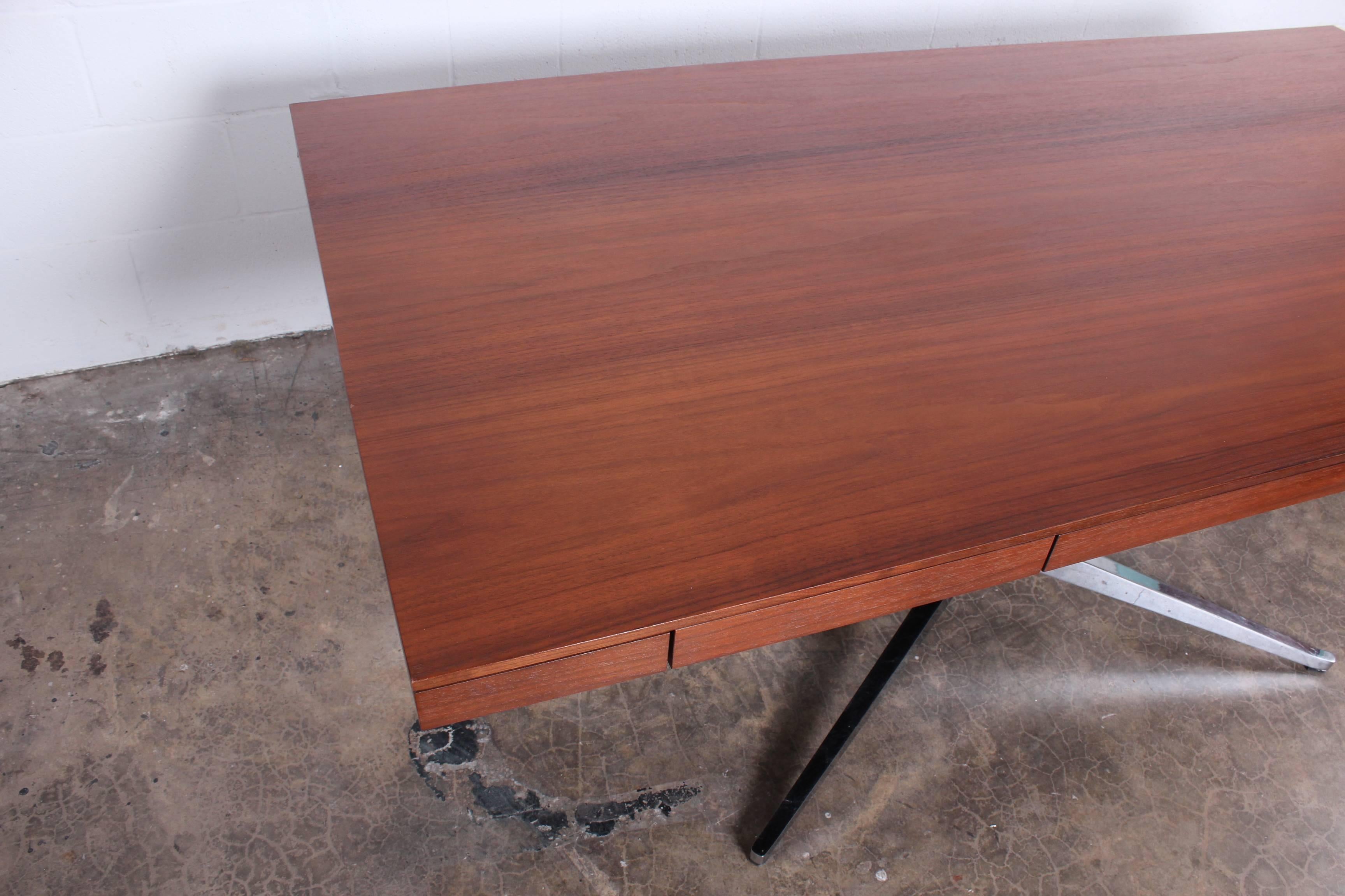 A rosewood partners desk designed by Florence Knoll.