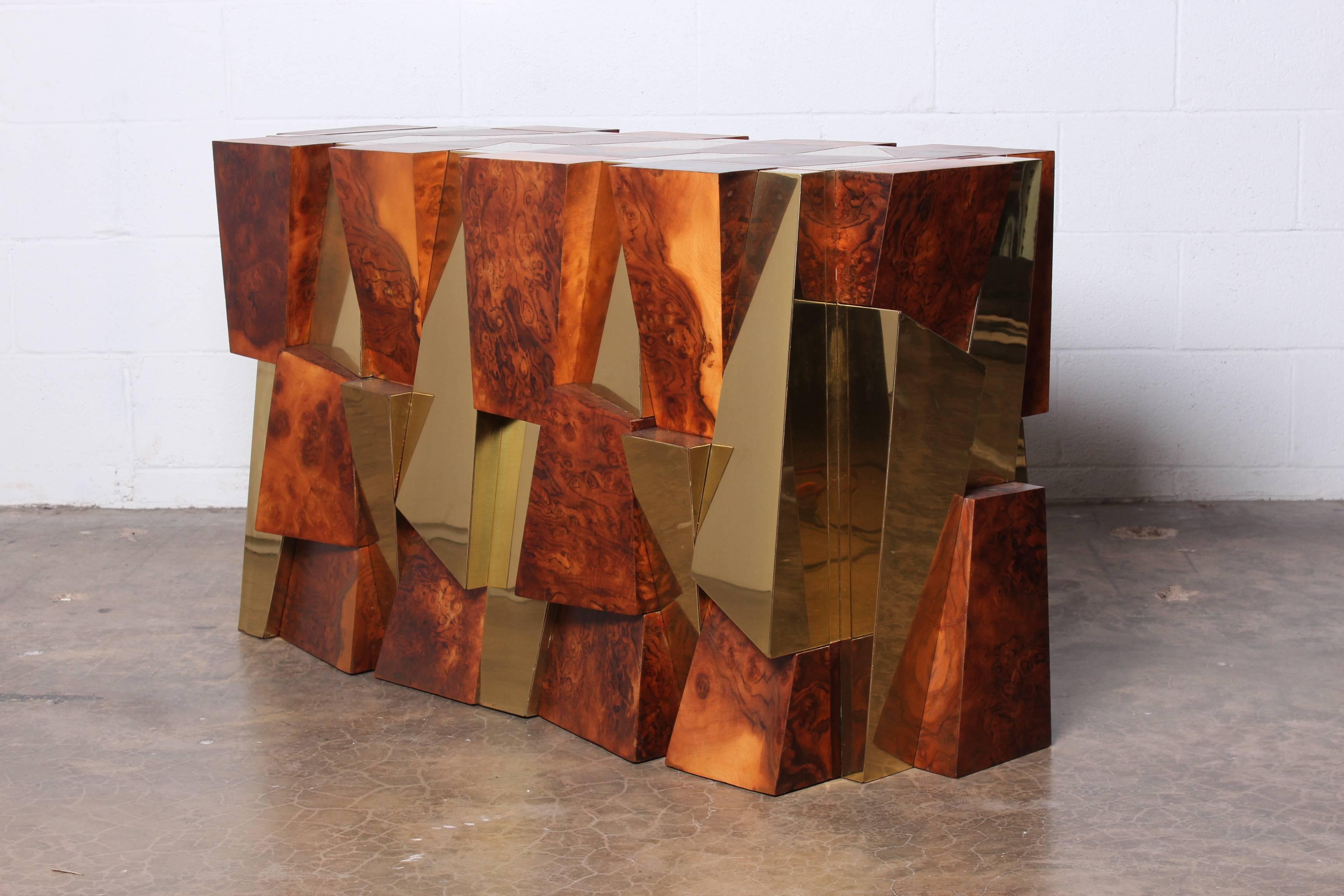 A burl and brass faceted dining table base or console designed by Paul Evans. Matching cabinet also available.