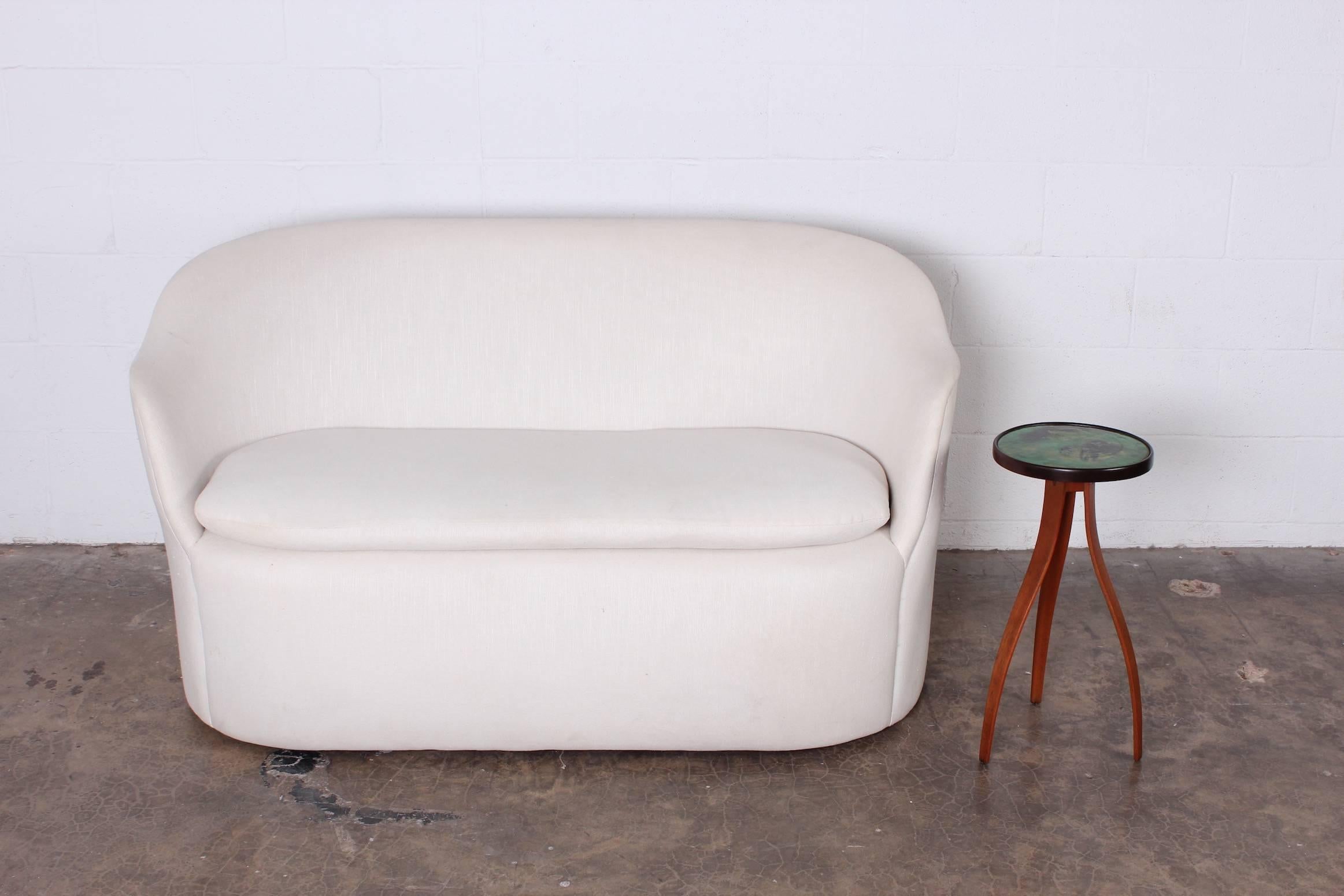 A small-scale sofa designed by John Saladino for Dunbar. Matching chair also available.