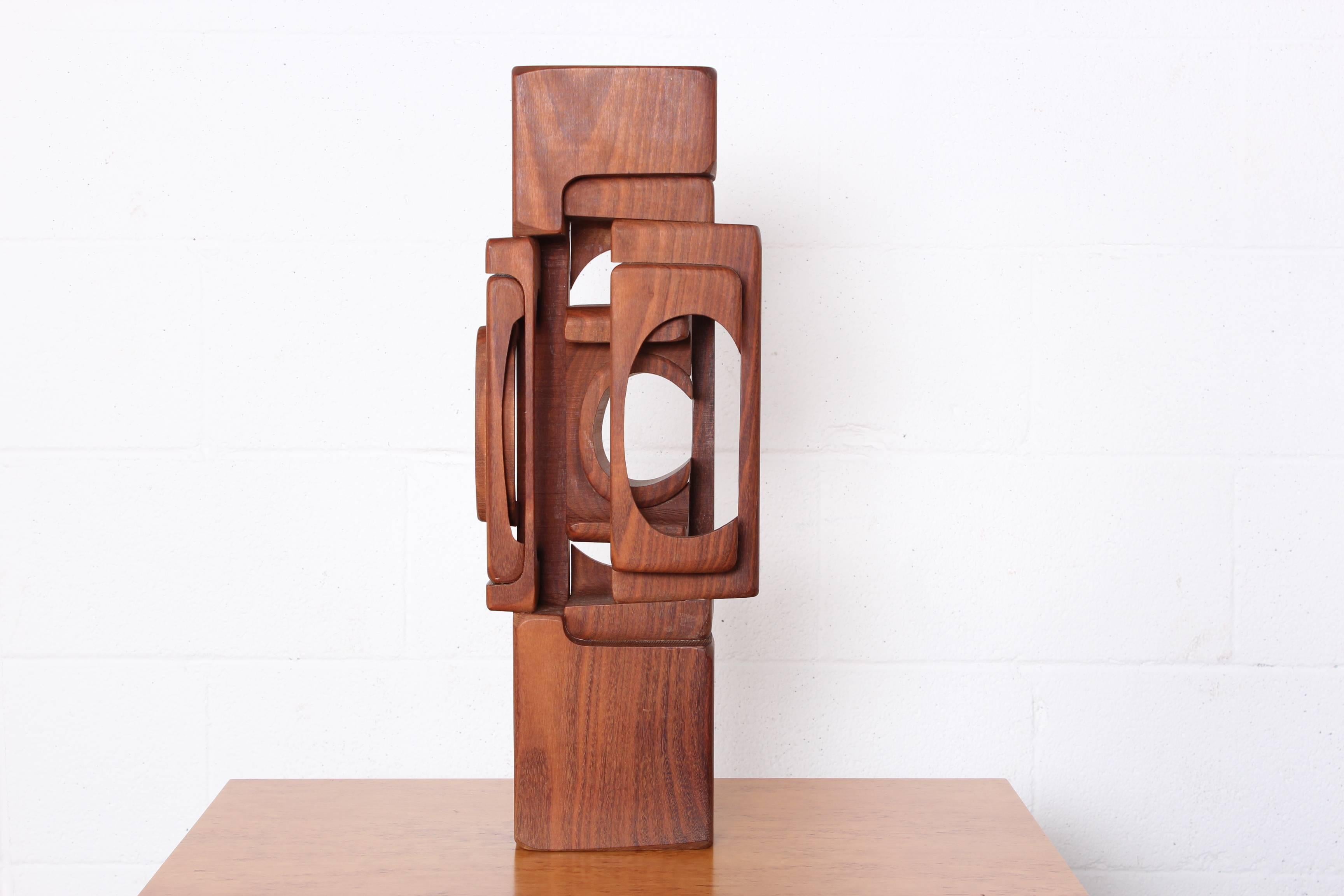 A carved and assembled wooden abstract sculpture by Brian Willsher, 1975.
