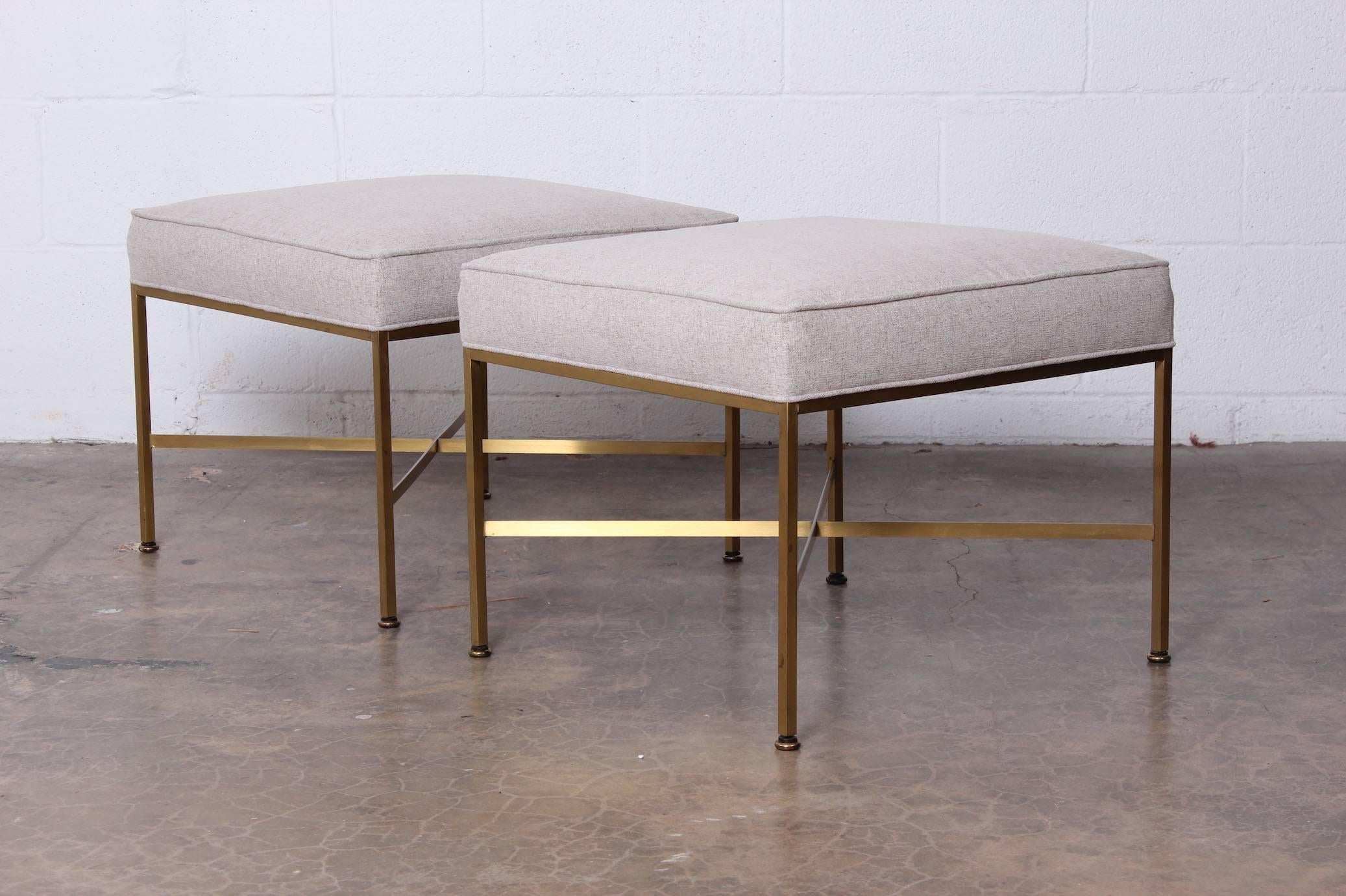 A pair of brass X-base stools designed by Paul McCobb for Directional Furniture Co. Matching console table also available separately.
