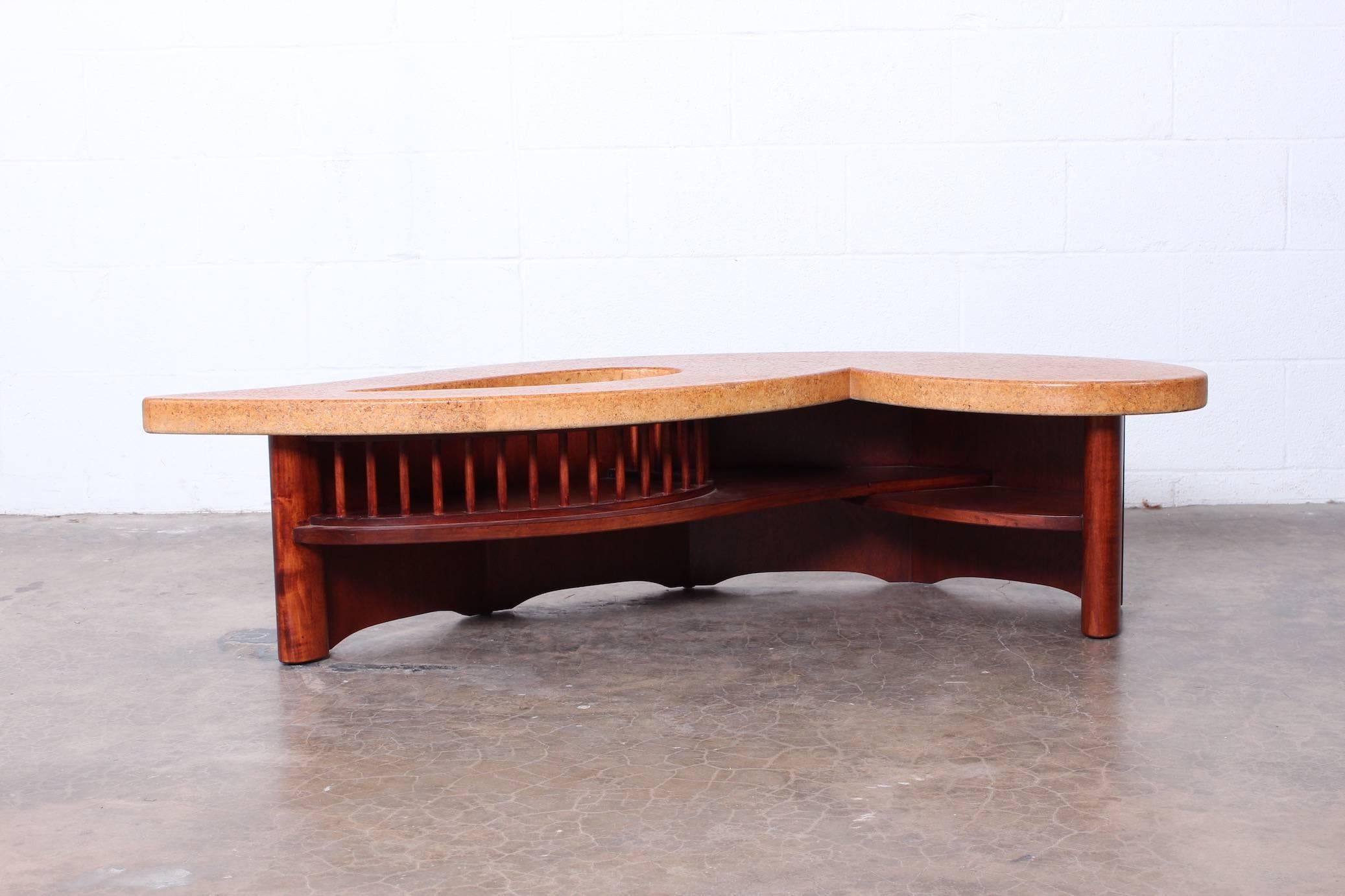 An unusual cork top coffee table with mahogany base. Designed by Paul Frankl for Johnson Furniture.
