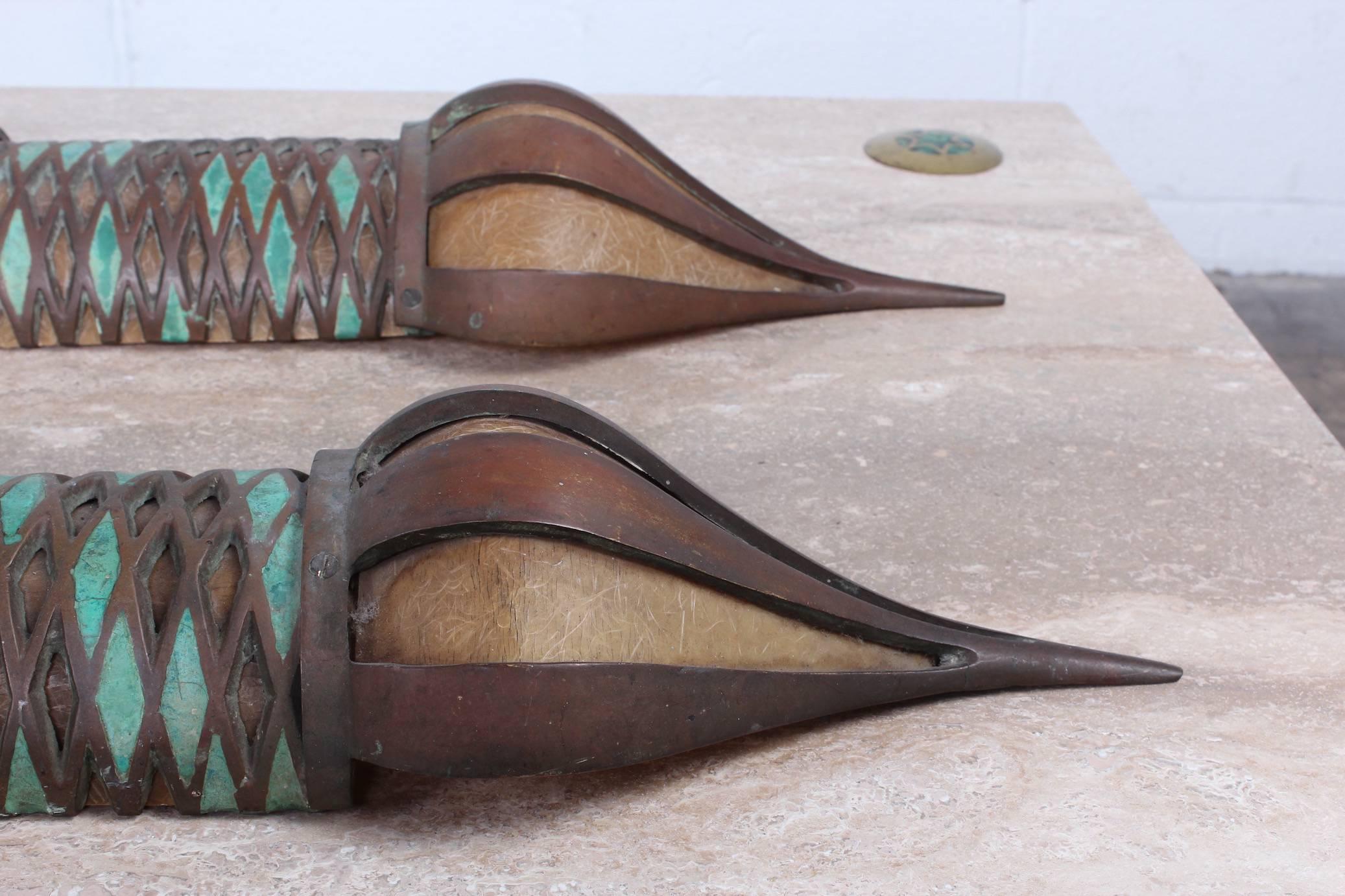 A rare pair of brass sconces with ceramic inlay and fiberglass defusers. Designed by Pepe Mendoza. Defusers can be taken out if desired. These have been used outside and have a heavy patina. No electrical included.