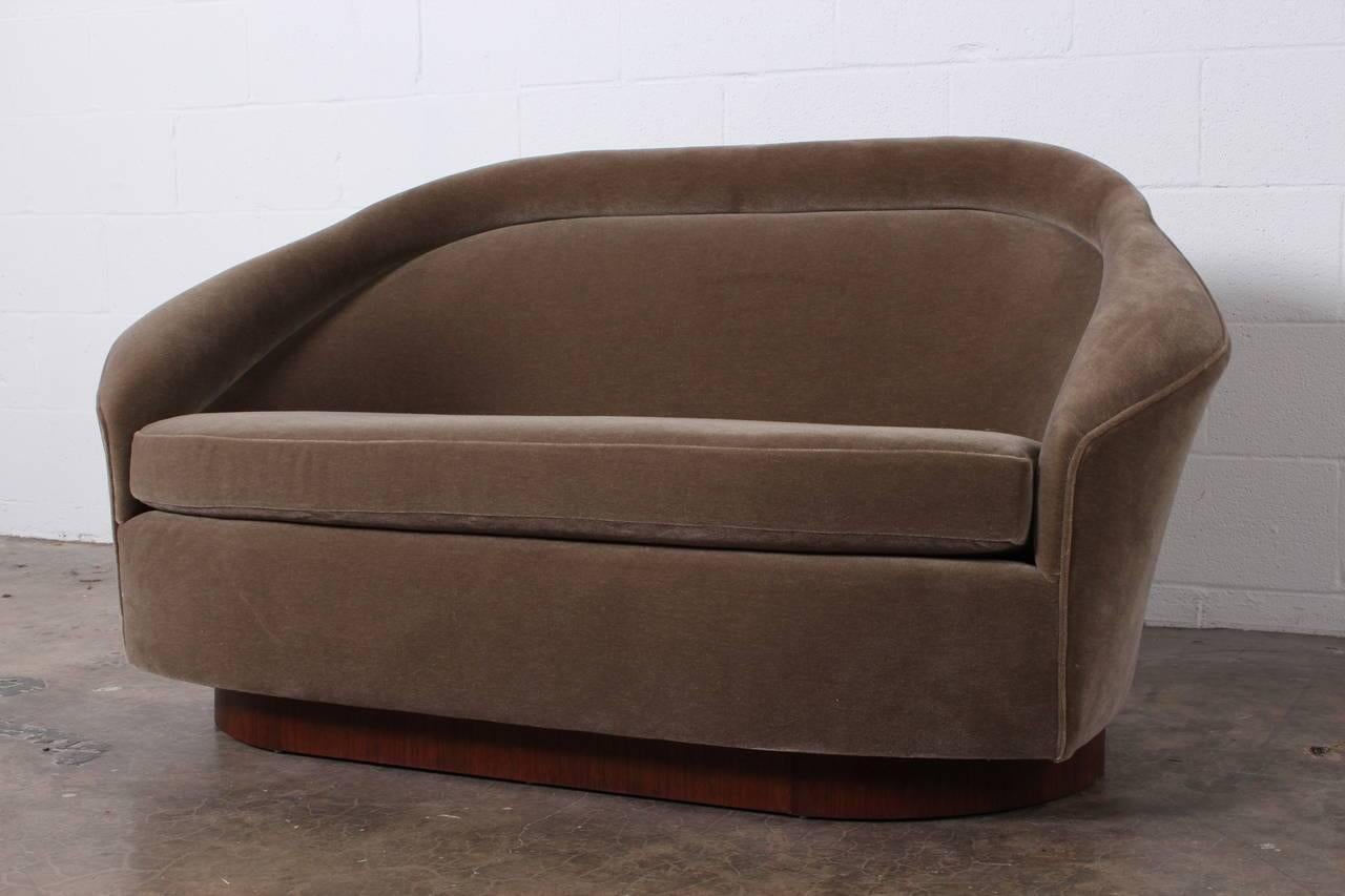 A very handsome loveseat designed by Adrian Pearsall for Craft Associates fully restored and upholstered in mohair.