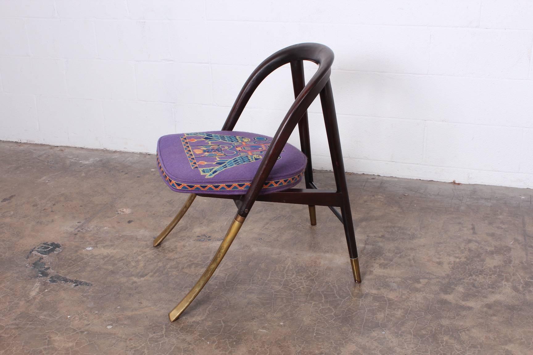A rare chair in mahogany with solid brass legs. Designed by Edward Wormley for Dunbar.