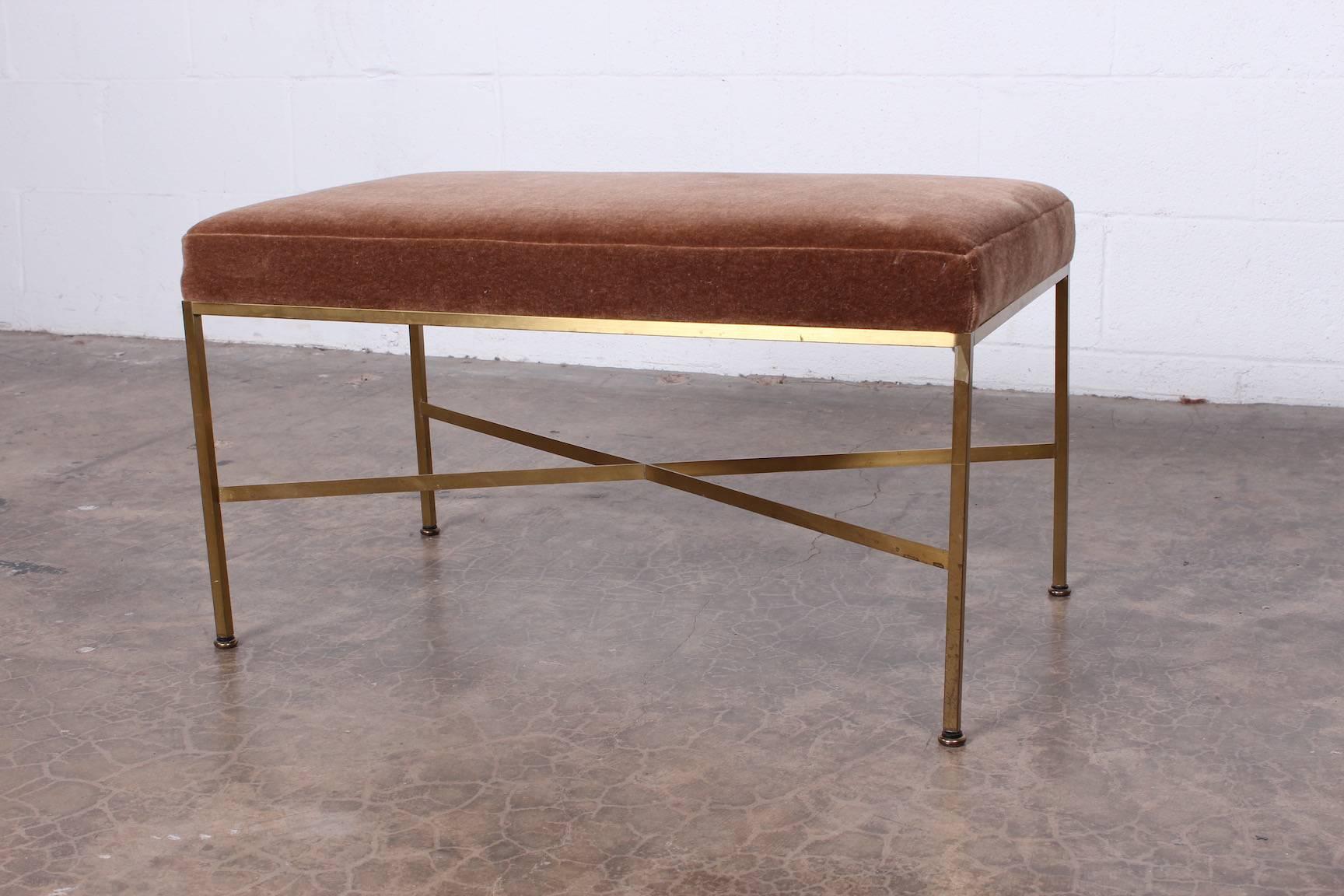 A brass and mohair X-base stool or bench designed by Paul McCobb for Calvin.