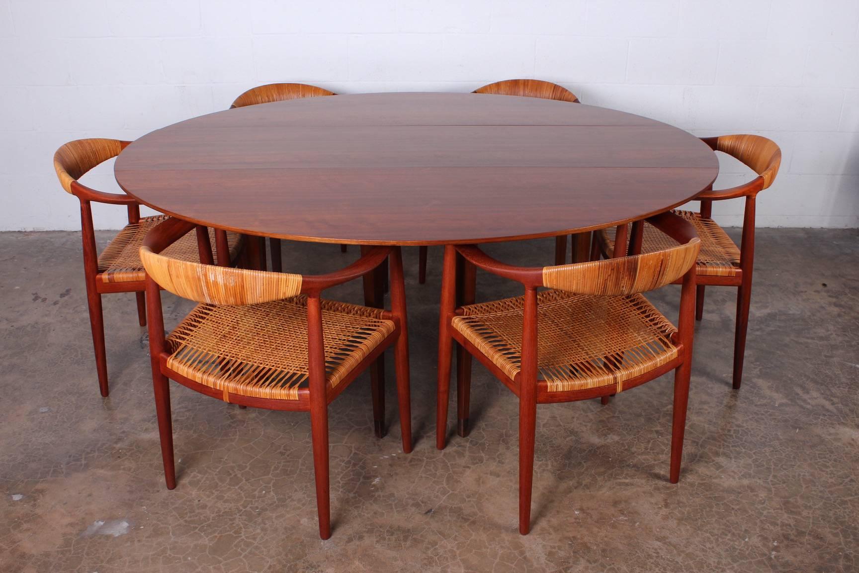 A beautiful and versatile drop-leaf console/dining table designed by Edward Wormley for Dunbar. Walnut with leather sabots to each leg.
Measures: 18.25 x 72 x 29 closed
60 x 72 x 29 open.