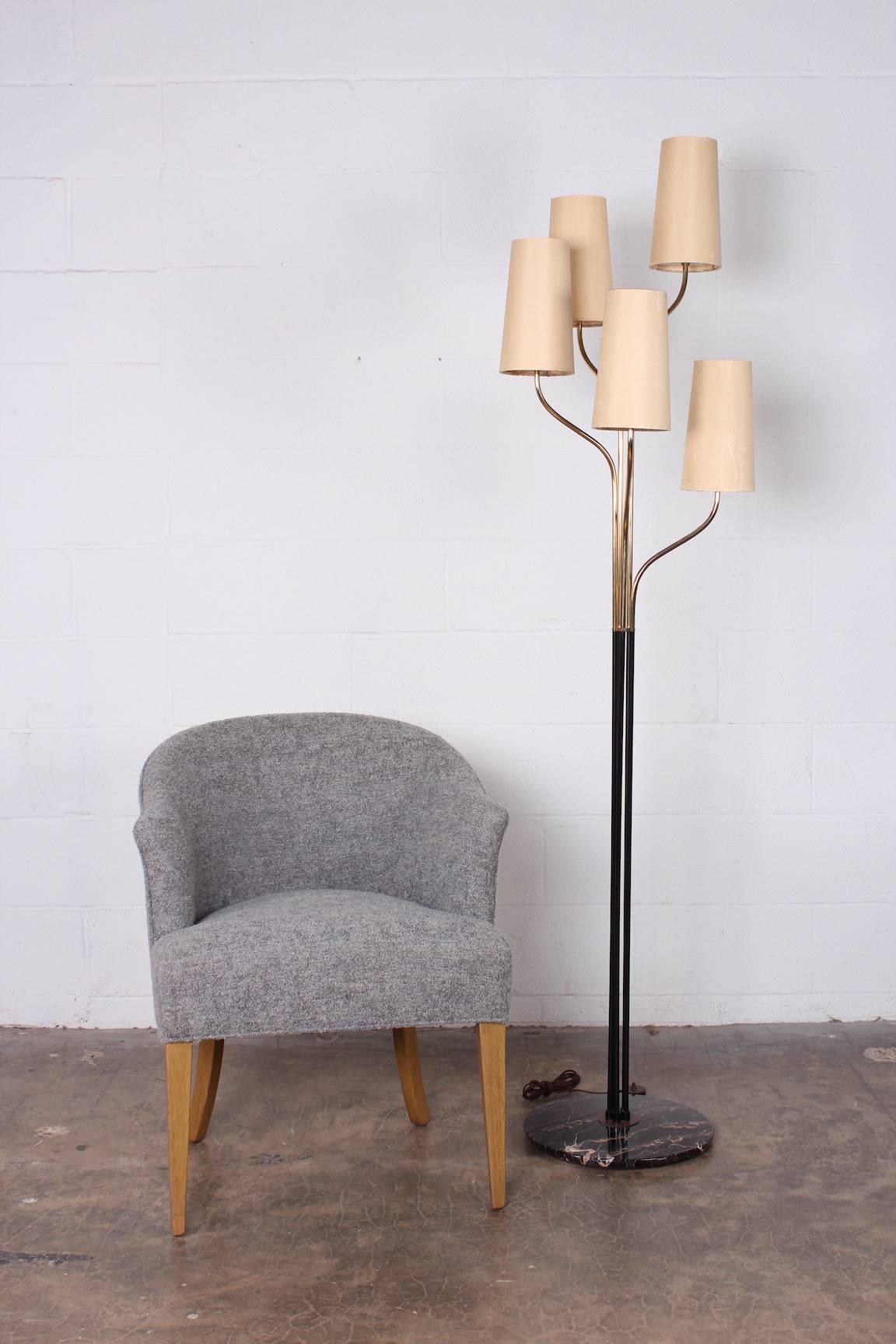 A well crafted Italian brass floor lamp on marble base.