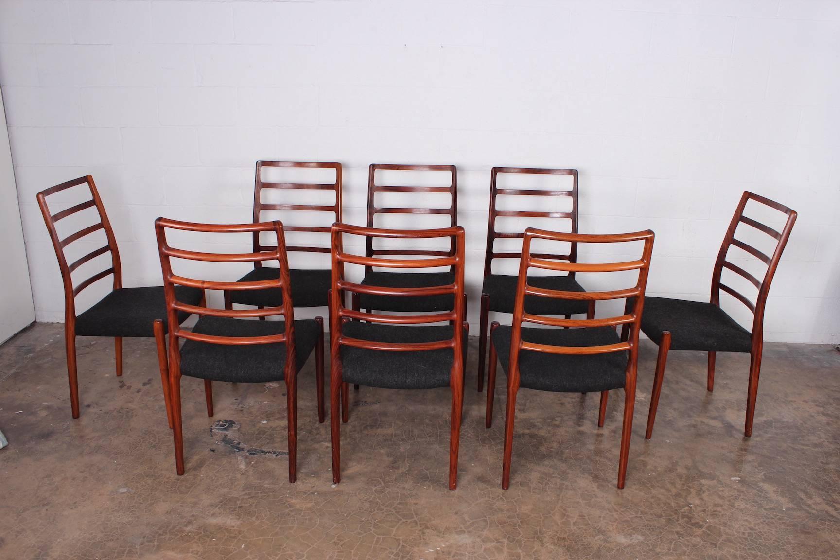 A set of eight solid rosewood dining chairs designed by Niels Møller.