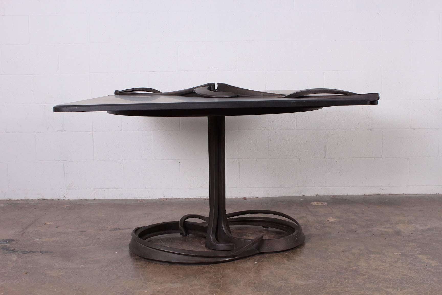 A forged steel and carved stone dining center table by Albert Paley. Stamped PALEY 1982. Published: Lucie-Smith, The Art of Albert Paley, Abrams, 1996, p. 197; Museum of Fine Arts, Albert Paley: The Art of Metal exhibition catalogue, Springfield,