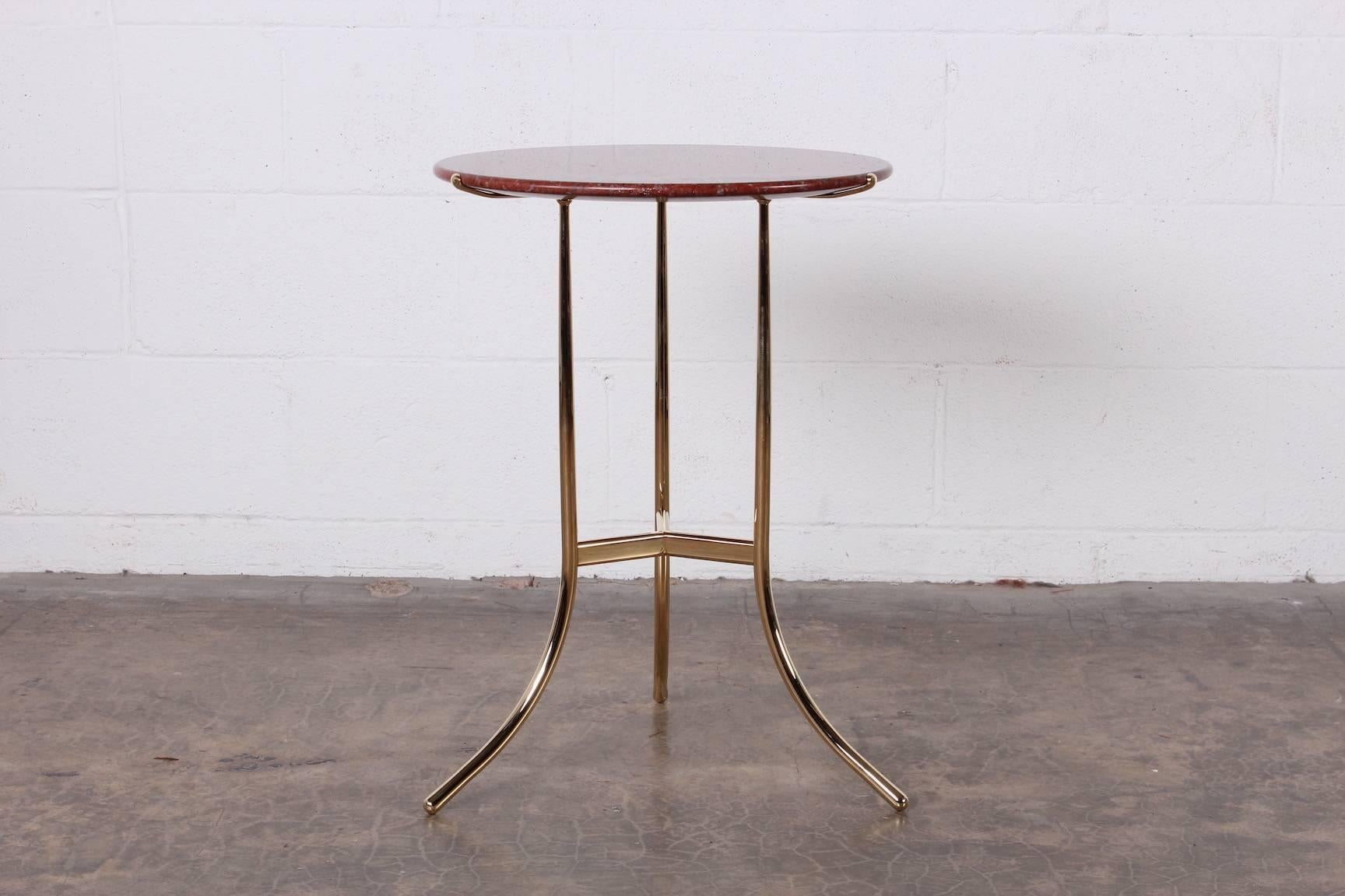 A perfectly polished brass Cedric Hartman side table with Rosso Tranas Rubino granite top, 1979.