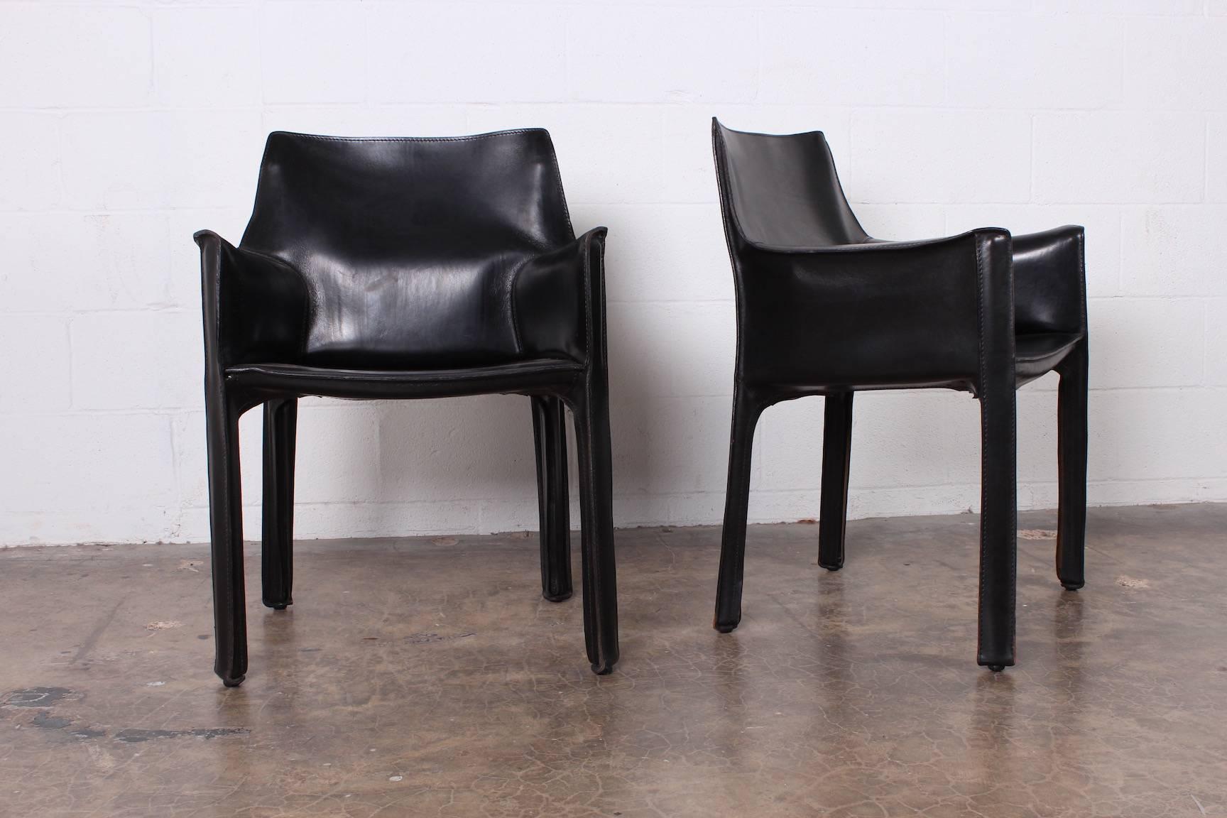 A vintage set of ten black leather Cab armchairs designed by Mario Bellini for Cassina.