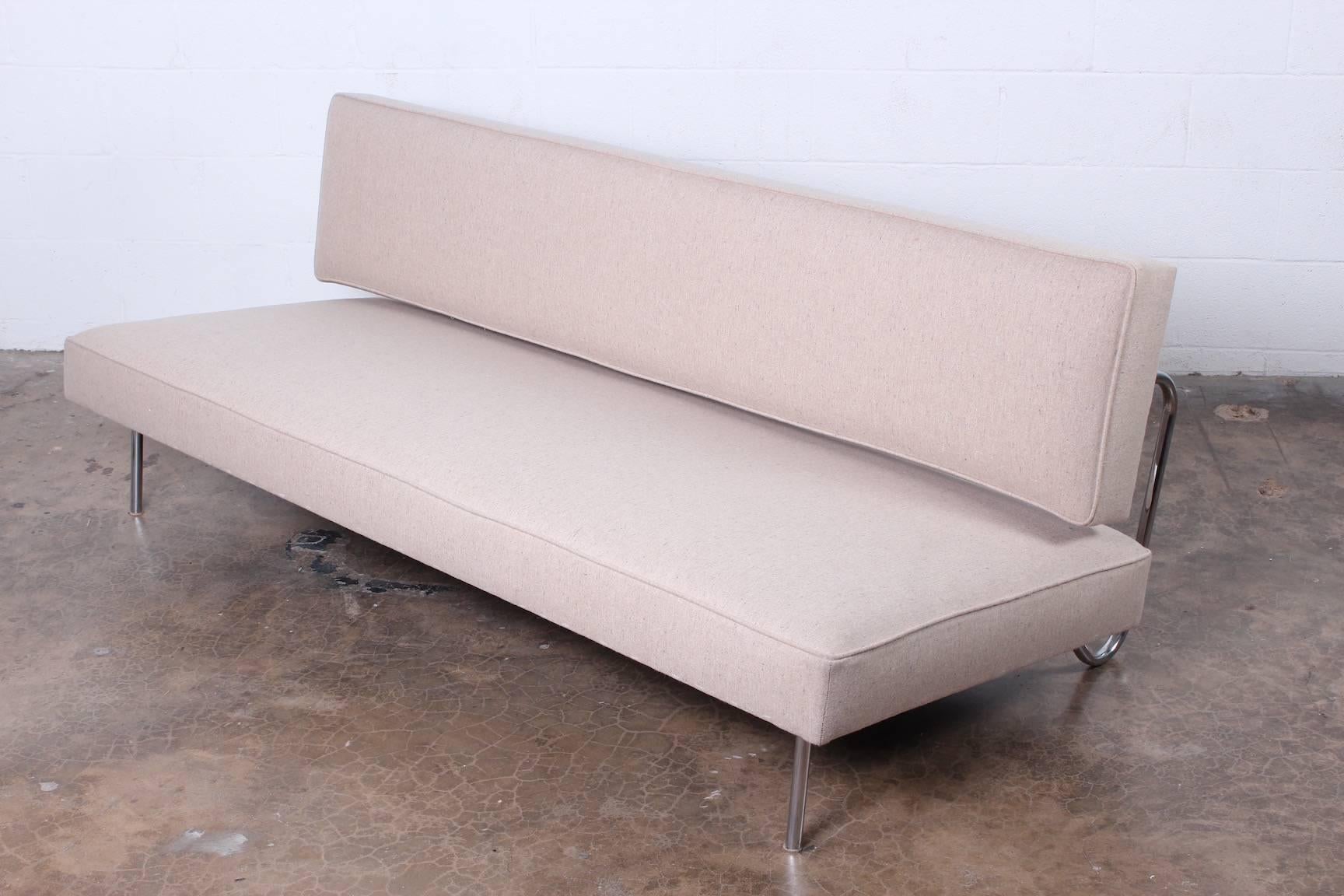 A sofa that converts to a bed designed by Ernst Ambühler, 1957 for Teo Jakob.