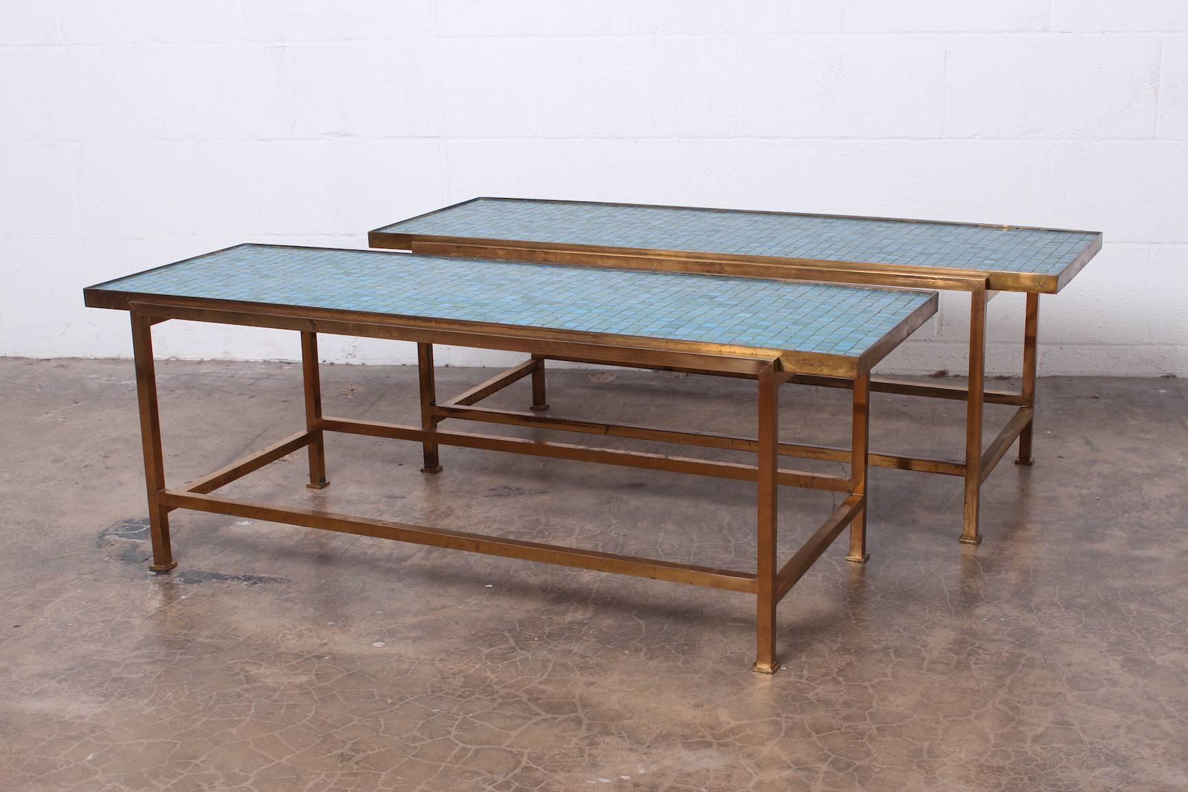 A matching pair of early Murano glass tile tables with brass bases. Designed by Edward Wormley for Dunbar.