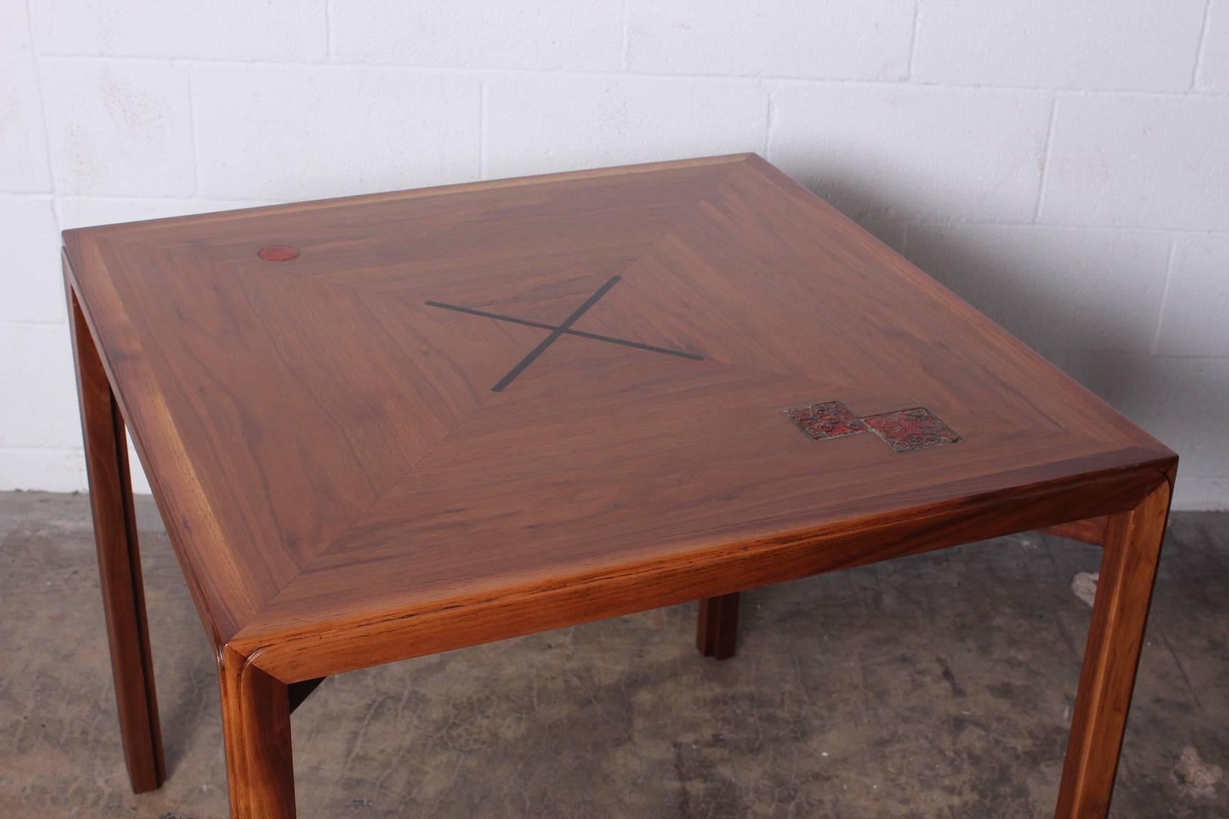 A rare walnut game table designed by Edward Wormley for Dunbar with ceramic tiles by Otto and Gertrude Natzler.
