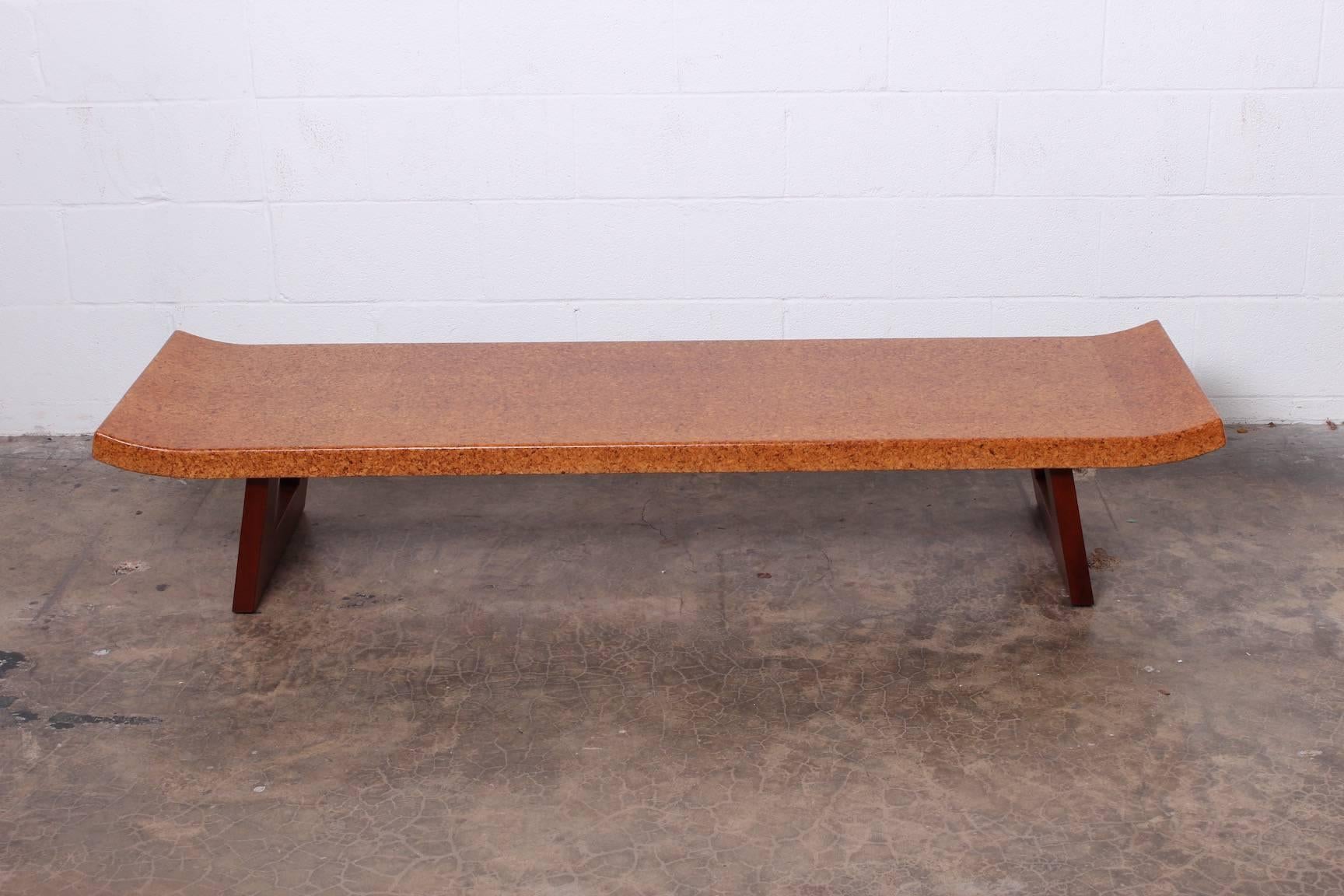 A mahogany and cork bench / coffee table by Paul Frankl for Johnson furniture.