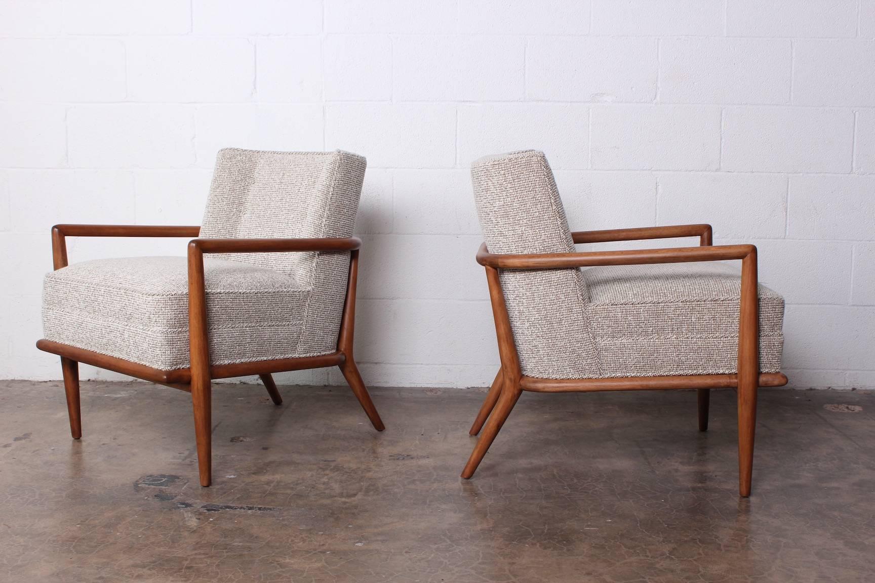 A rare pair of maple lounge chairs with mohair upholstery. Designed by T.H. Robsjohn-Gibbings for Widdicomb.