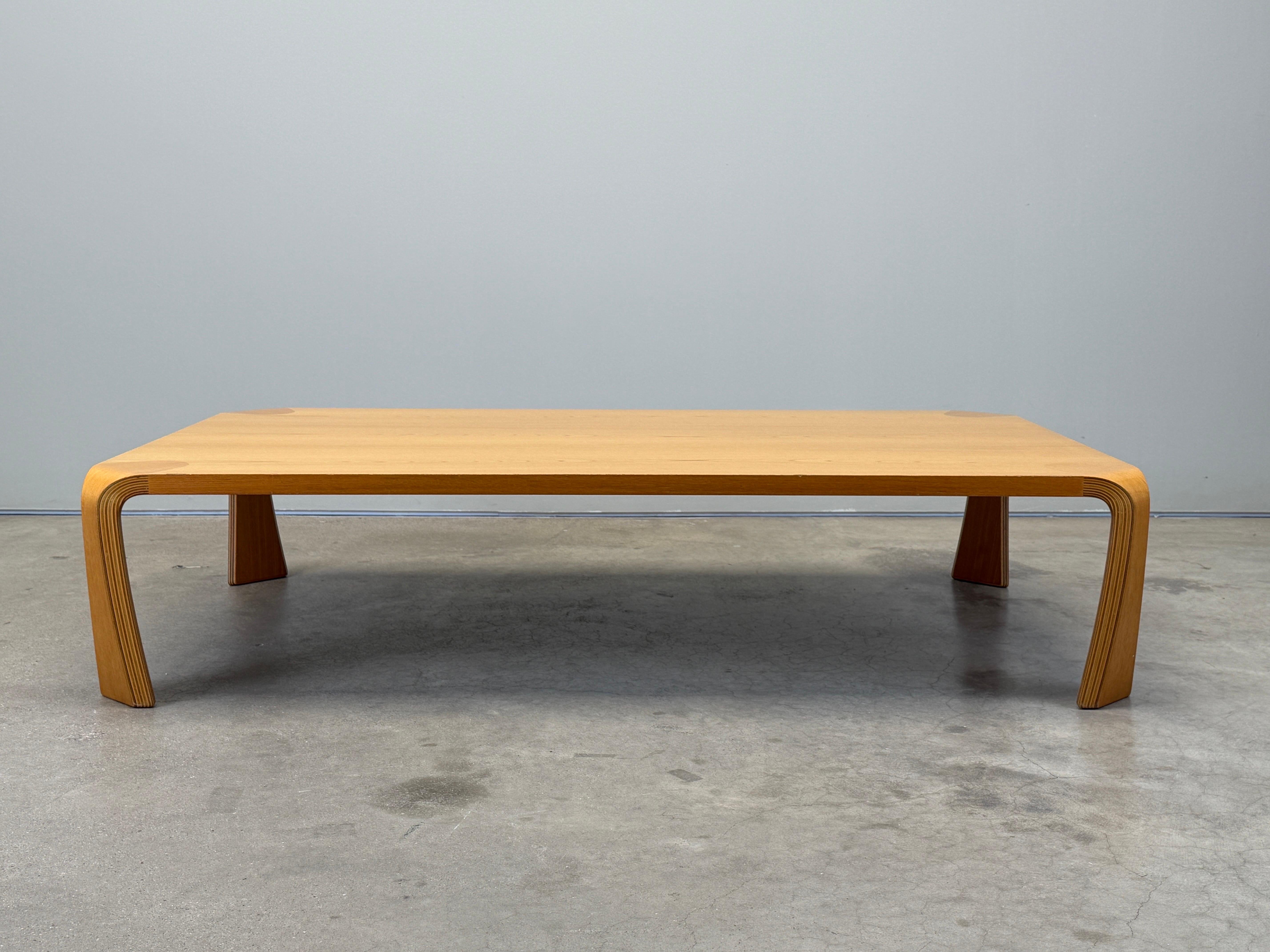 A large laminated wood coffee table designed by Inui Saburo for Tendo Mokko.