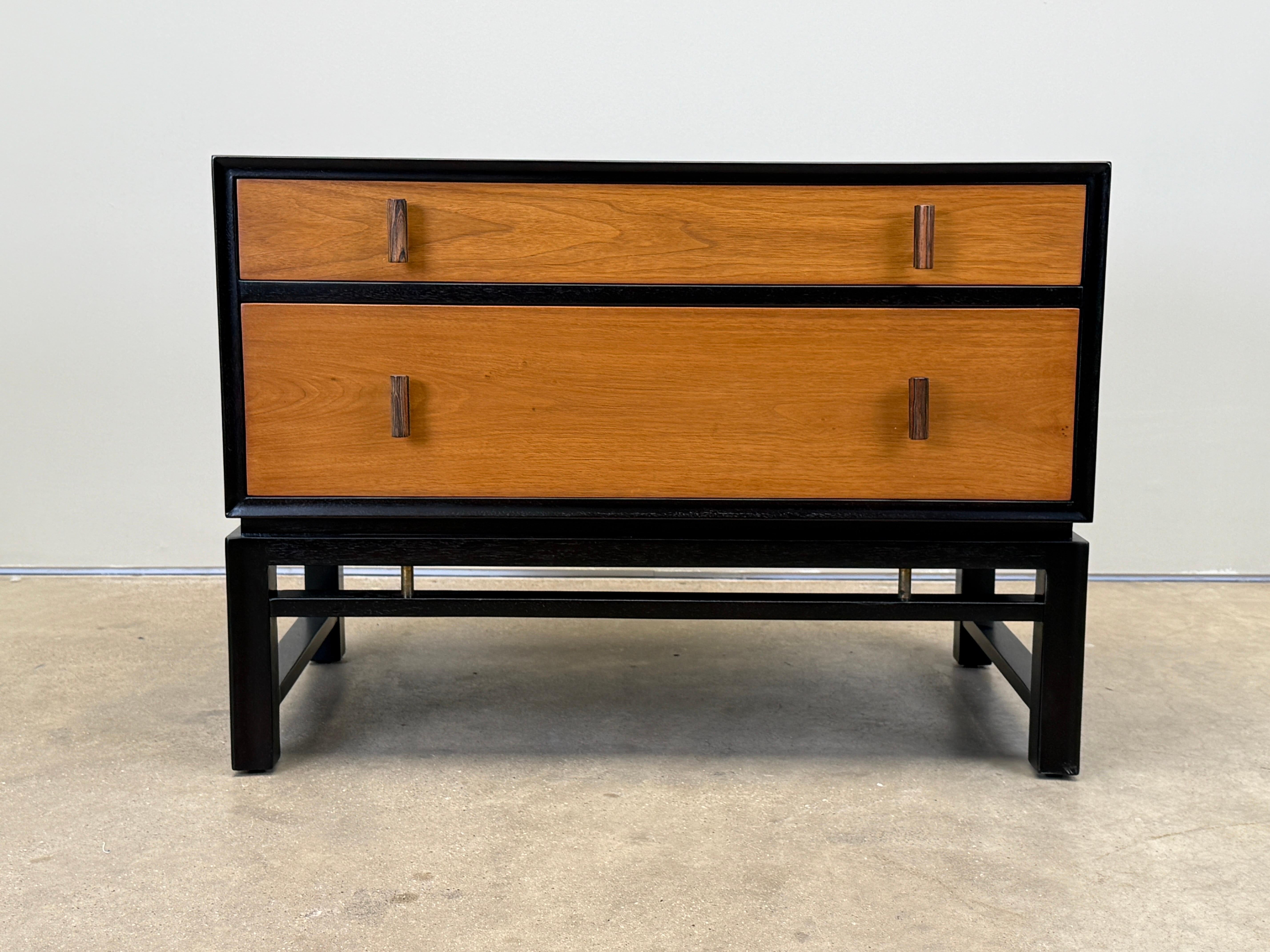 A mahogany chest with bleached walnut drawers and rosewood pulls. Designed by Edward Wormley for Dunbar. 
