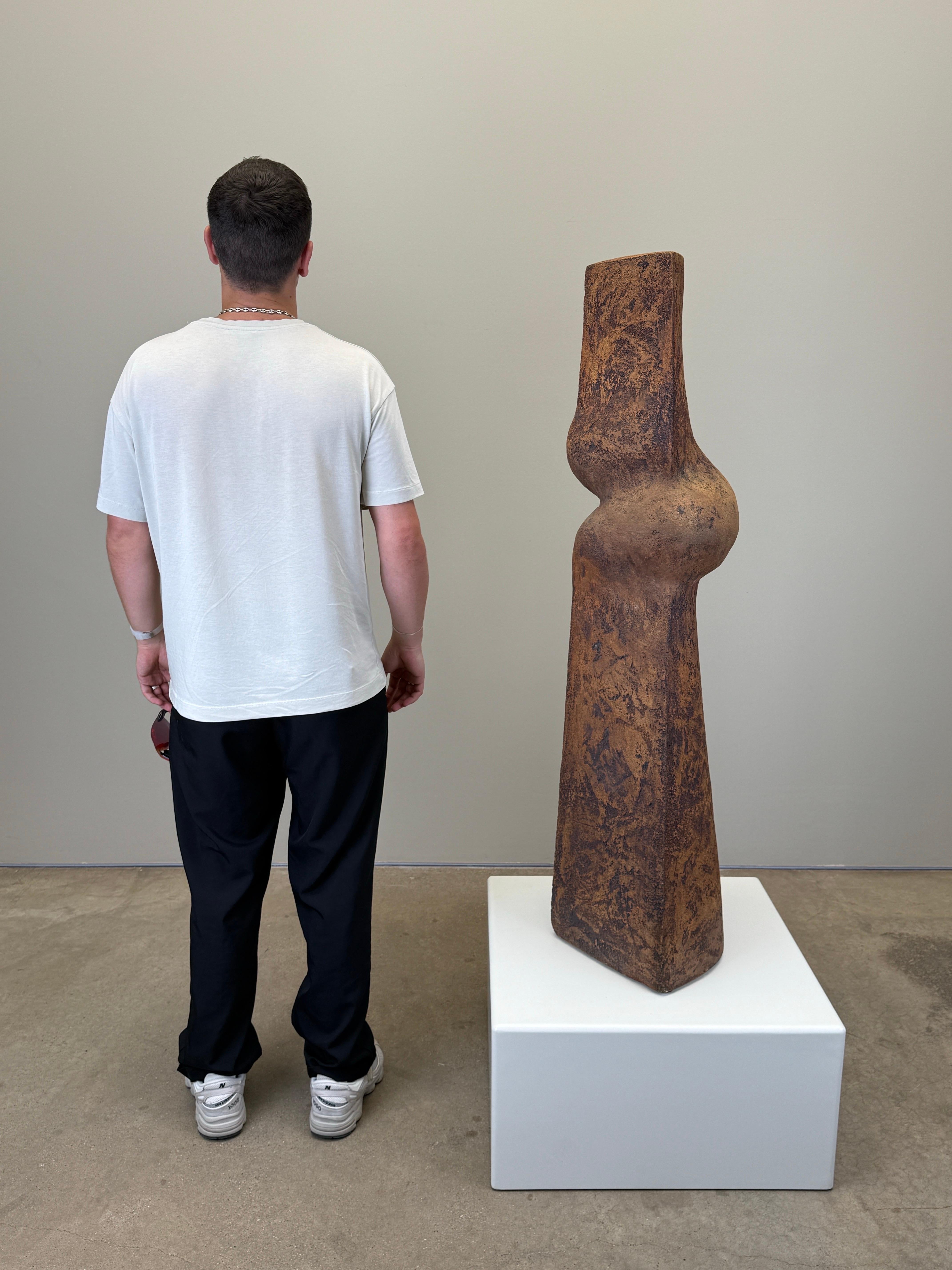 A large and early ceramic totem sculpture by Michael Arntz, 1964.
