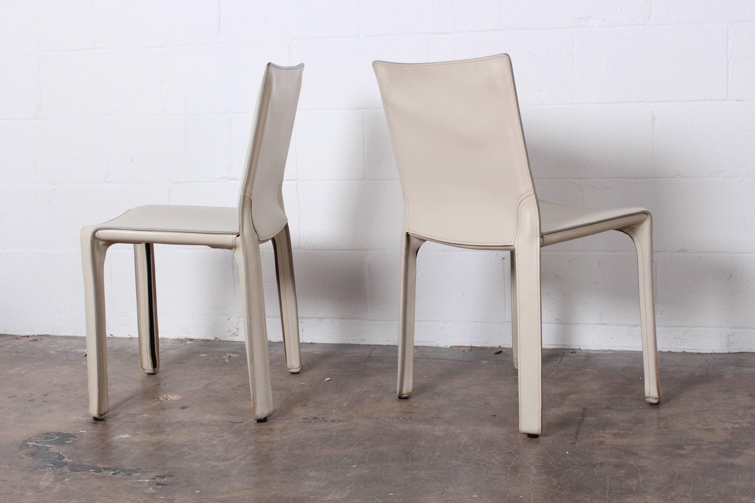 A set of six ivory Cab chairs designed by Mario Bellini for Cassina.