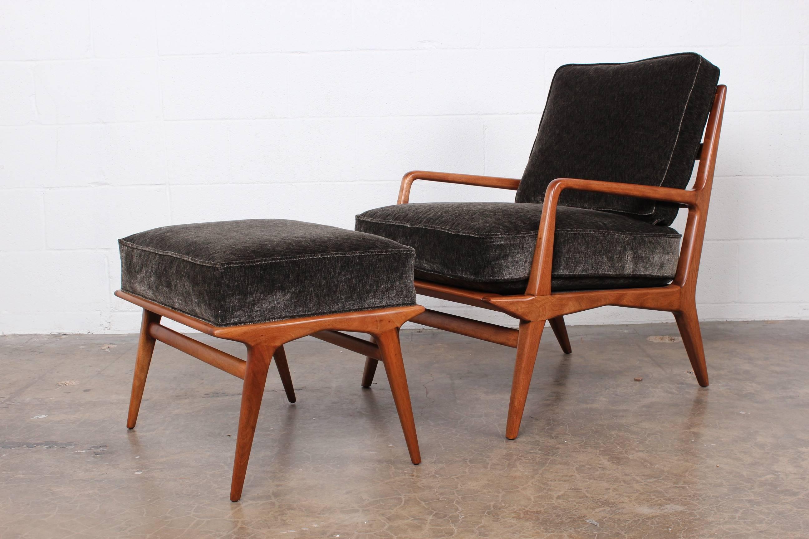 A lounge chair and ottoman designed by Carlo de Carli for Singer & Sons.