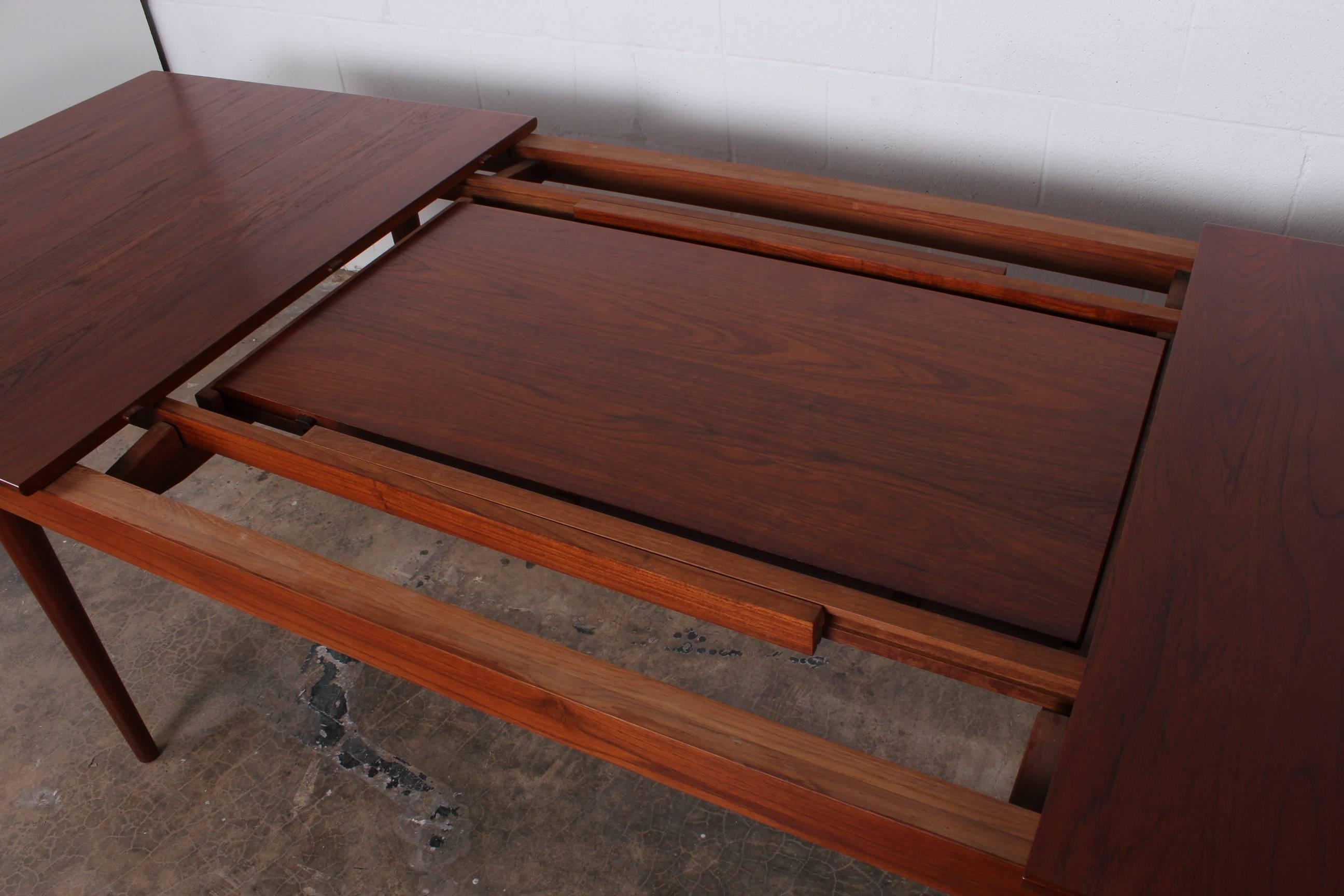 A solid teak 540 dining table designed by Finn Juhl for France & Sons. Two 20