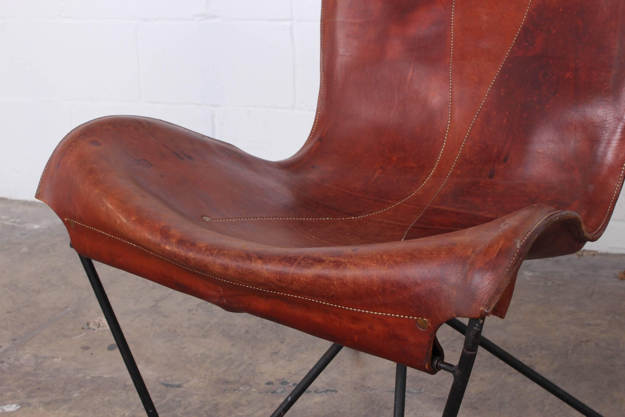 A beautifully patinated leather lounge chair with iron frame made by Max Gottschalk.