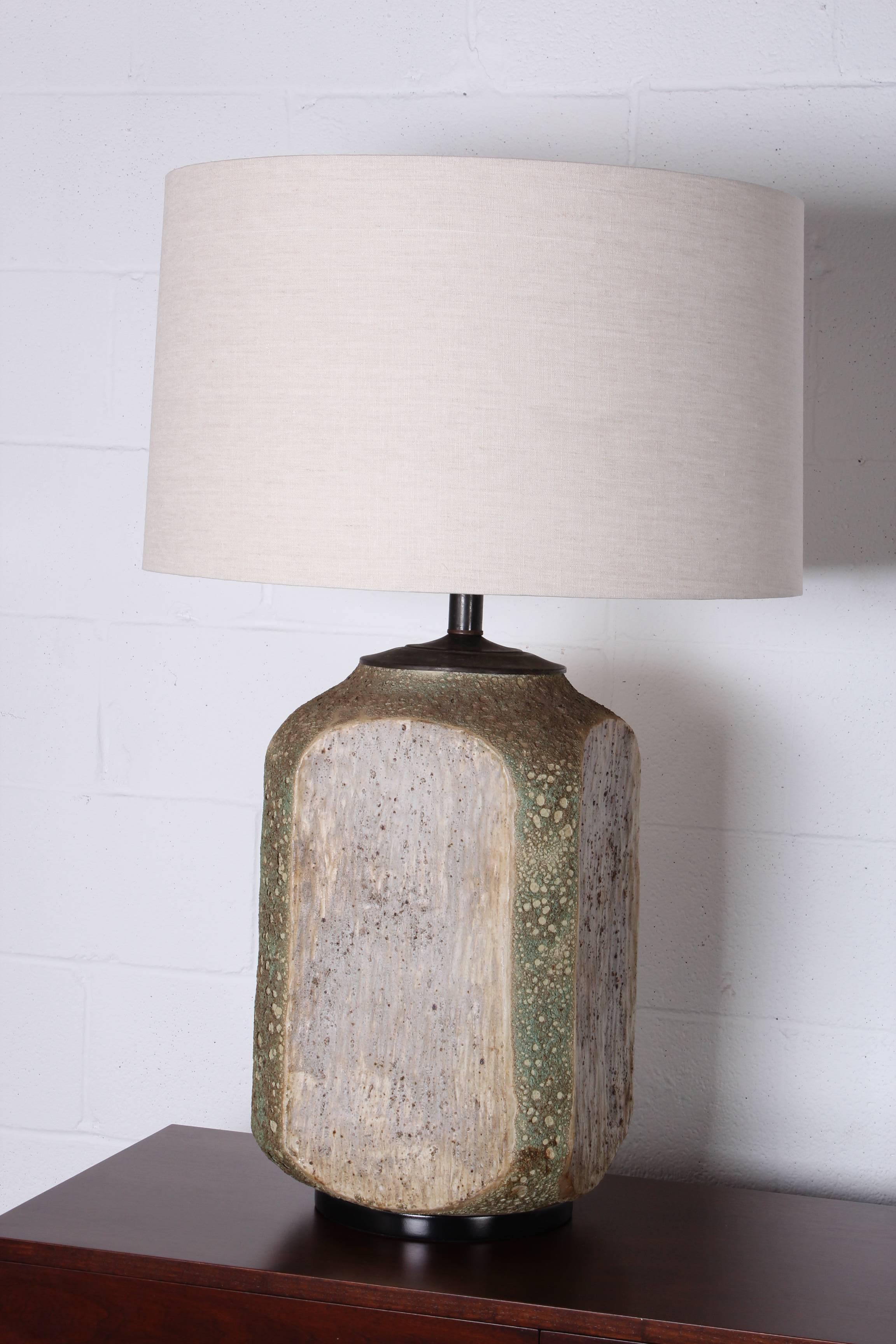 A monumental table lamp with volcanic glaze. Rewired with new linen shade.
