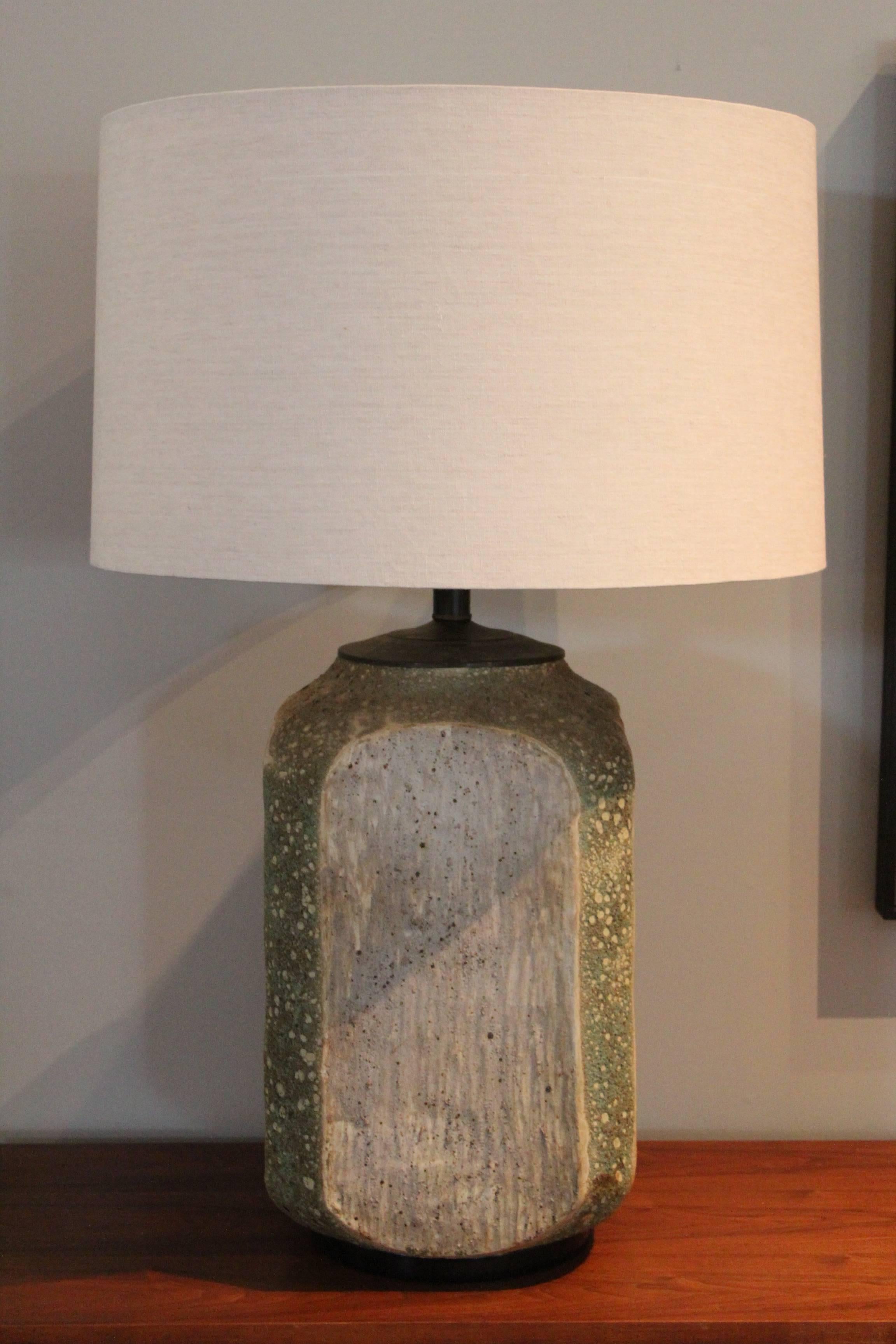 A massive textural volcanic glazed table lamp.