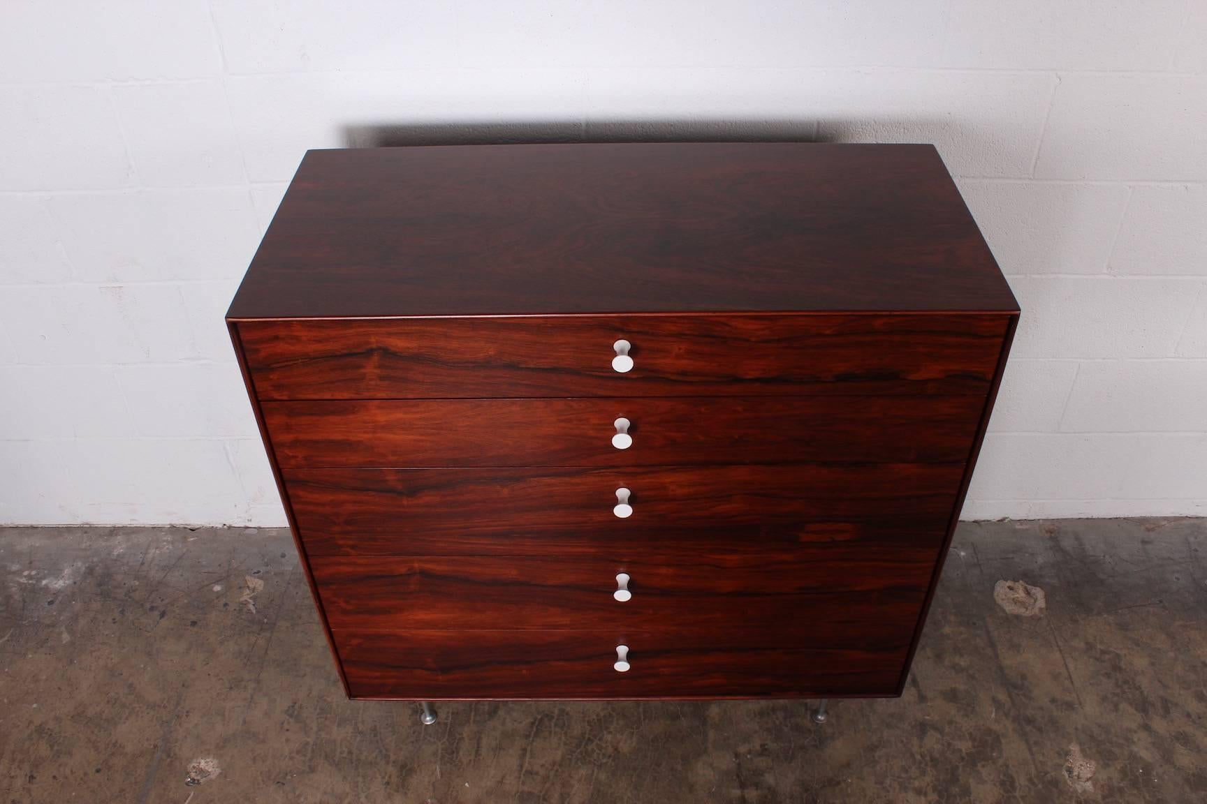 A beautifully grained rosewood thin edge dresser designed by George Nelson for Herman Miller.