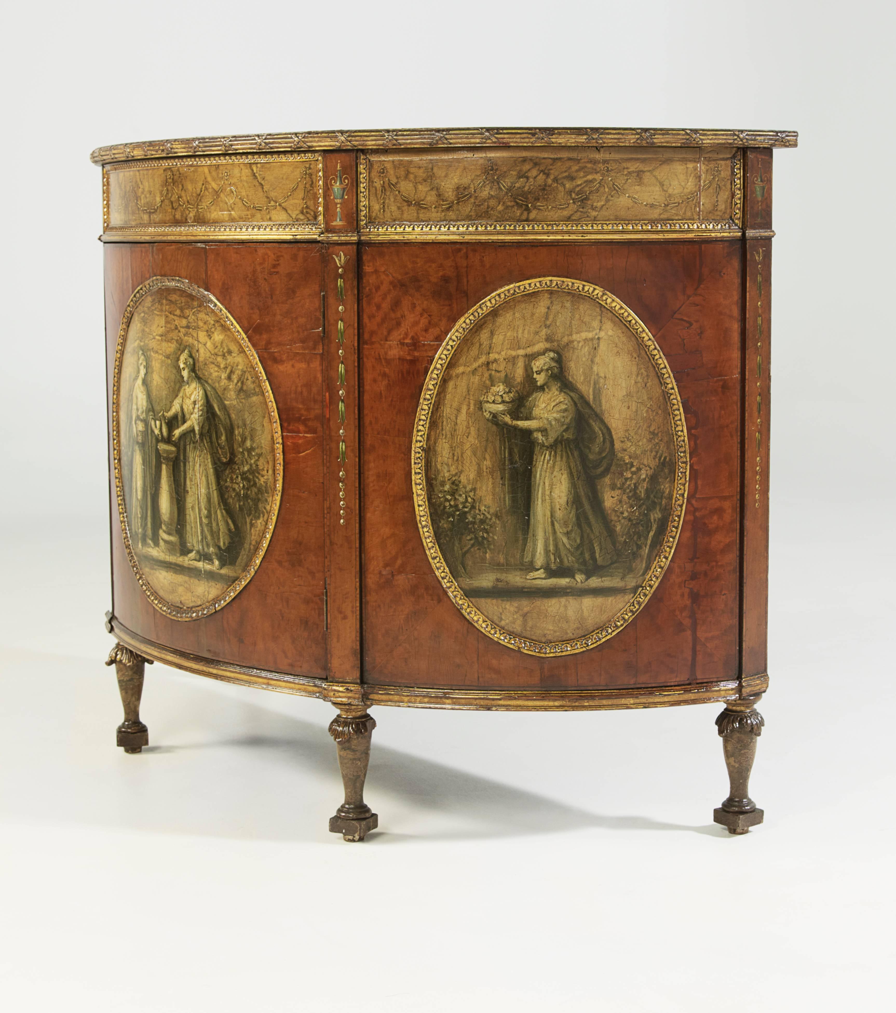 George III-style walnut, faux marble and polychrome demilune cabinet, late 19th century, in the Adam taste, the top with a polychrome, floral and annulated banding around a faux marble panel, above a conforming case fitted with a single cupboard