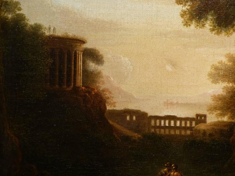A good oil on canvas pastoral landscape painting in the manner of Claude Lorrain (Claude Gellee 1600-1682), with figures in the foreground at the edge of a lake, temple and aqueduct in the background. Tivoli? Please note measurements are without