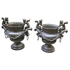Pair of Bronze Cherub Urns