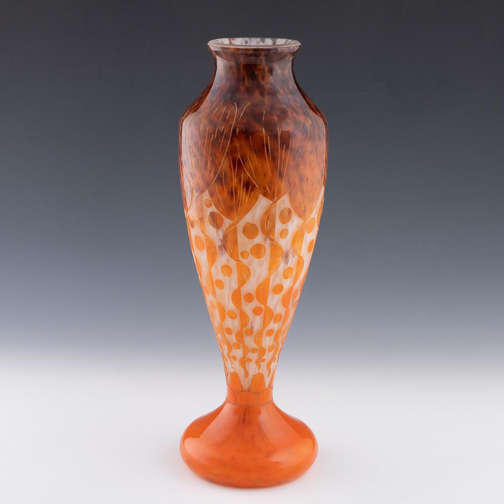 Heading : Schneider le Verre Francais vase – Rubaniers
Date : c1925
Origin : Epinay-sur-Seine. France
Bowl Features : Mottled brown, white, and orange glass depicting stylised ribons of foliage
Marks : Signed Le Verre Francais to the upper foot
Type